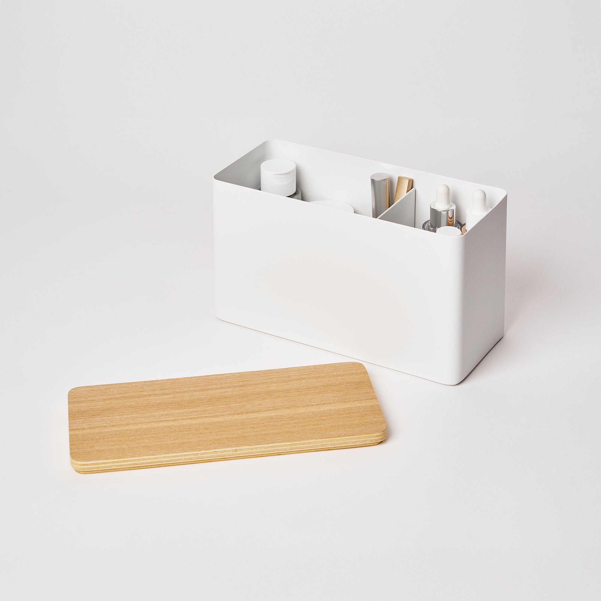 White desk organizer with compartments and a wooden tray on a white background