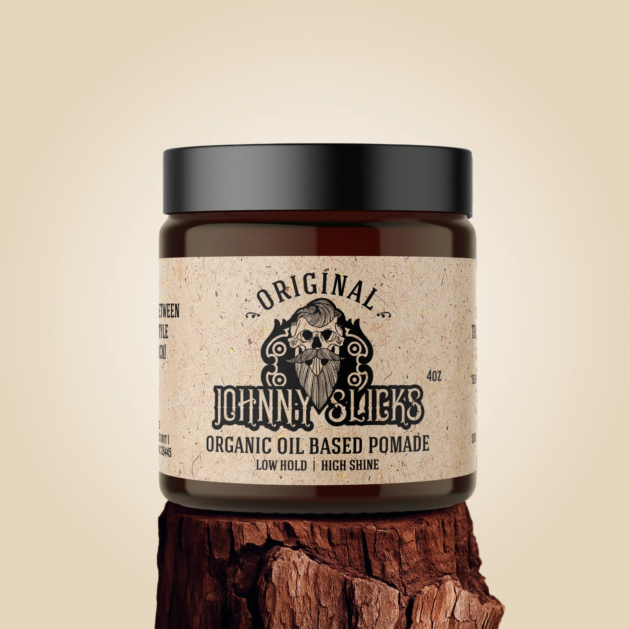 Jar of Johnny Slicks organic oil-based pomade on a wooden block with a beige background