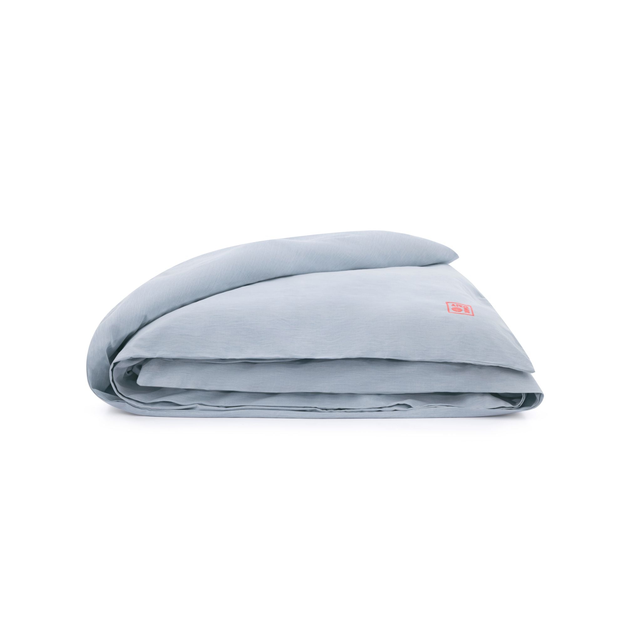 Folded light blue blanket with a brand logo on a white background
