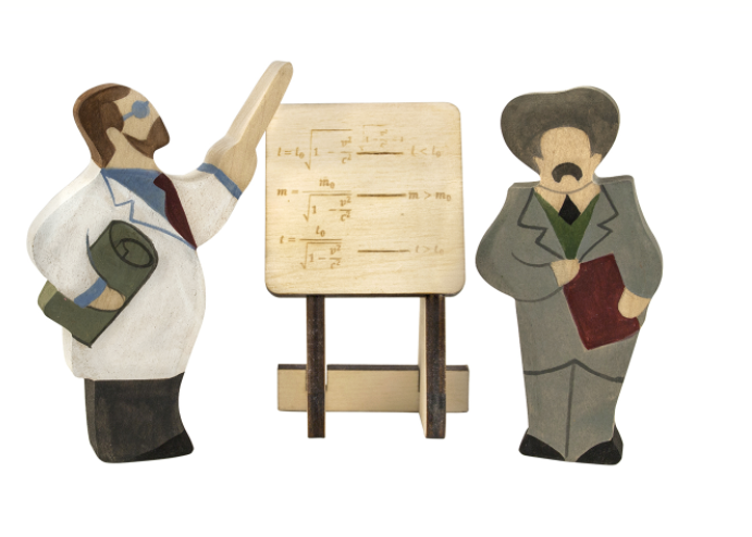 Wooden figurines of a teacher and a student with a music sheet on a stand.