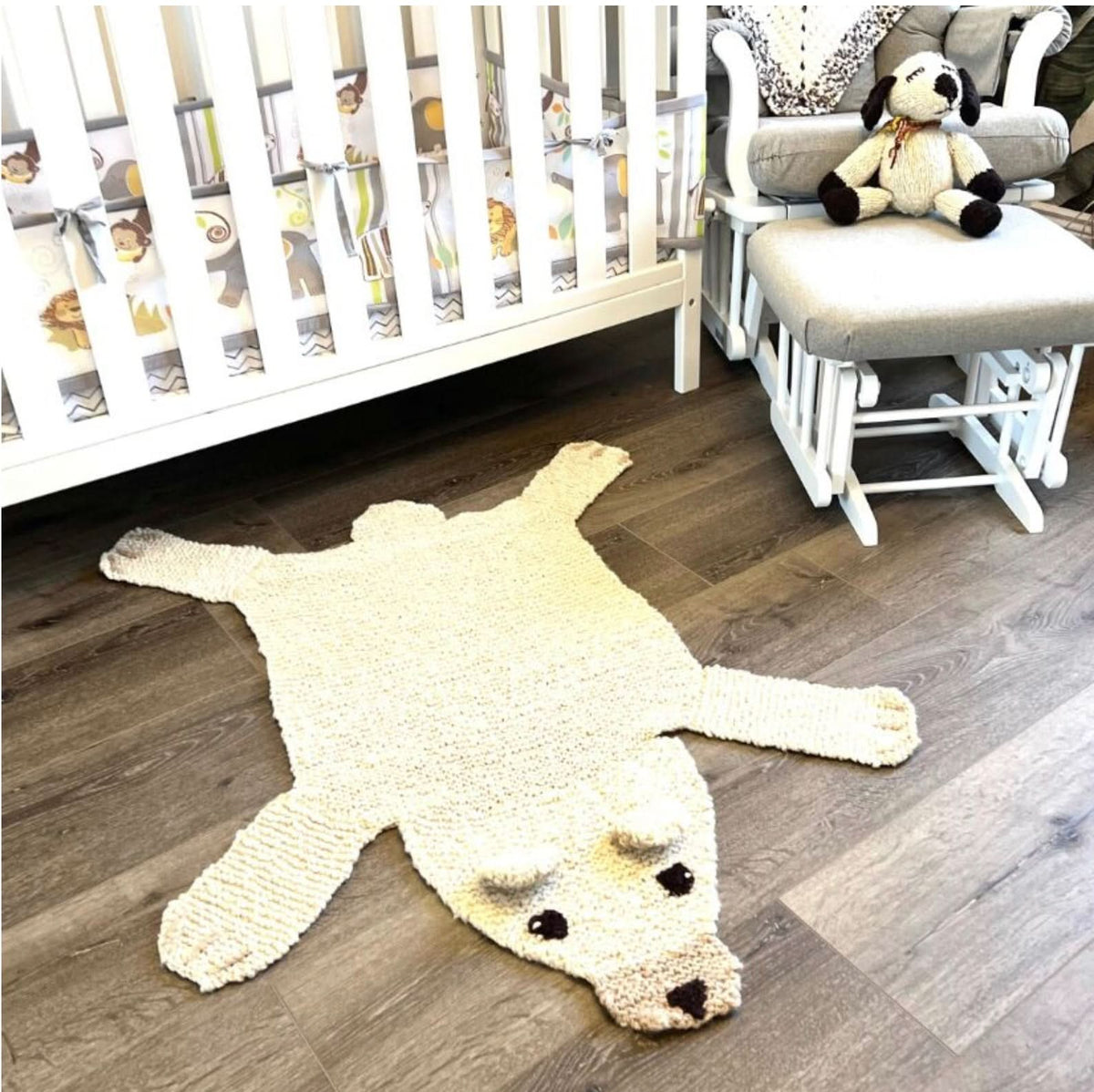 Finn + Emma polar bear wool play mat in a nursery setting