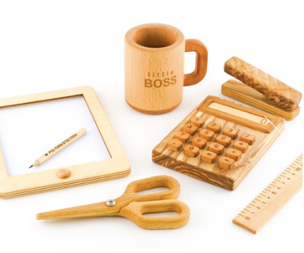 Collection of wooden office supplies including a mug, calculator, scissors, and photo frame on a white background.