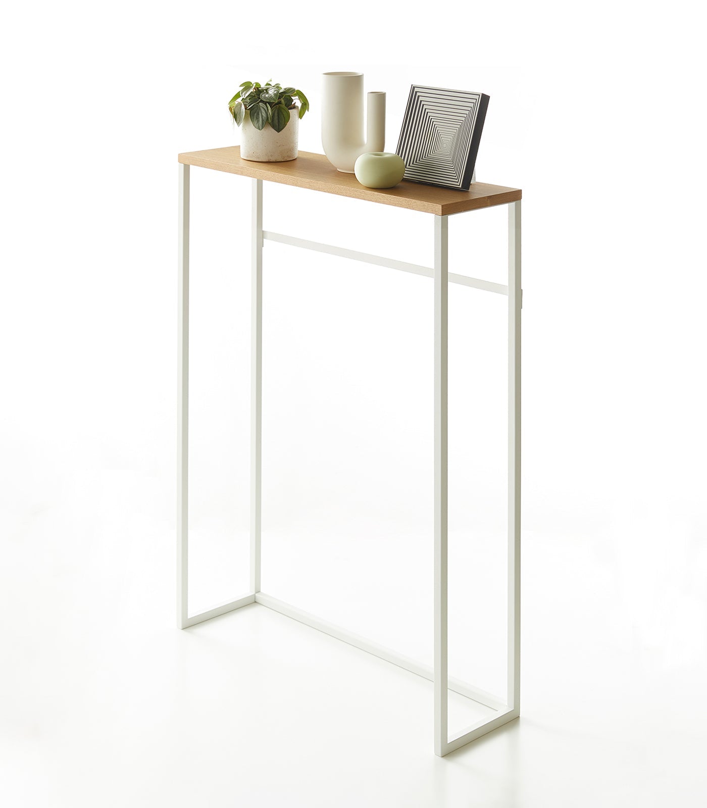 Small wooden table with white metal legs on a white background