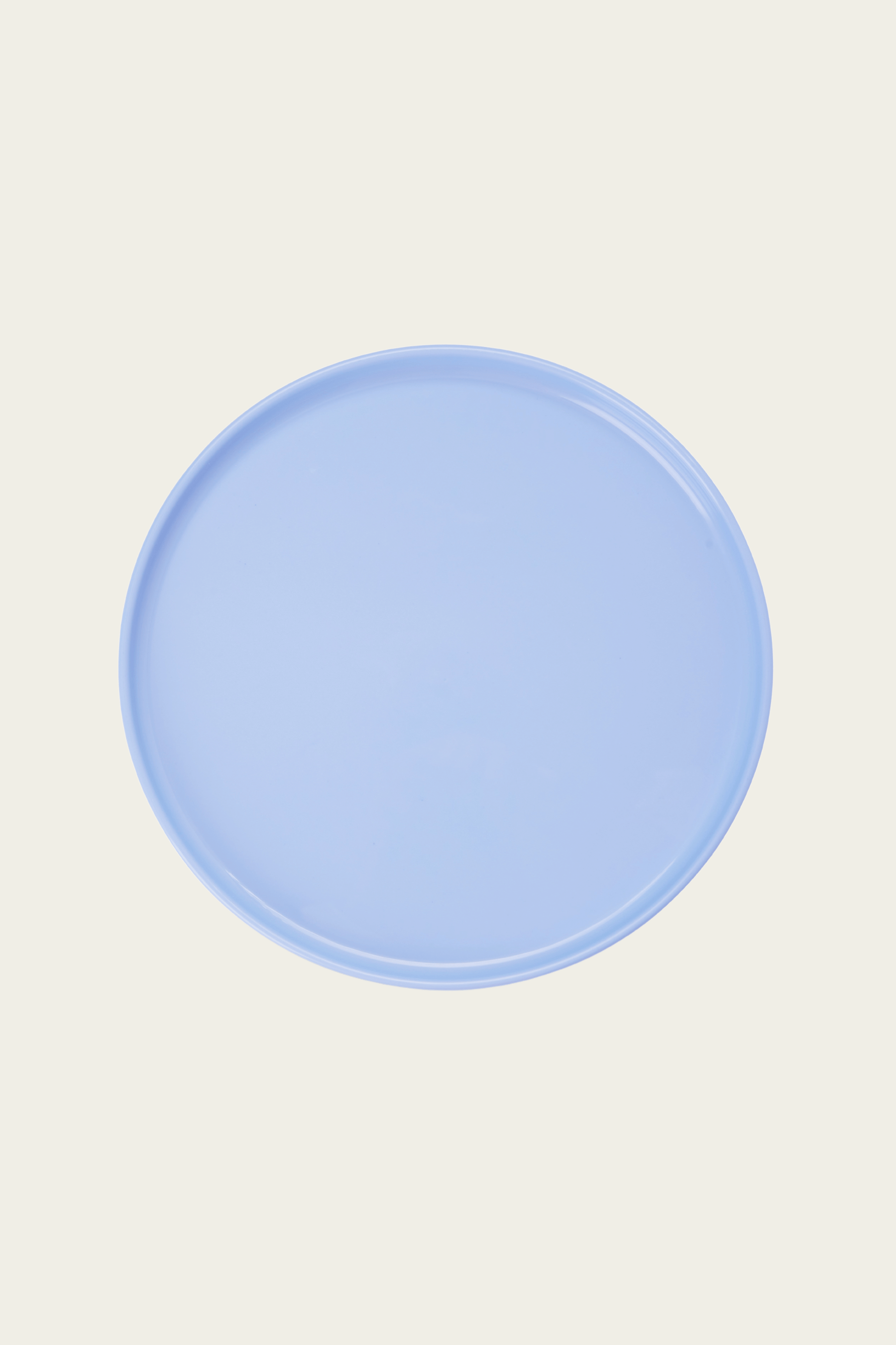 Light blue plate on a beige background