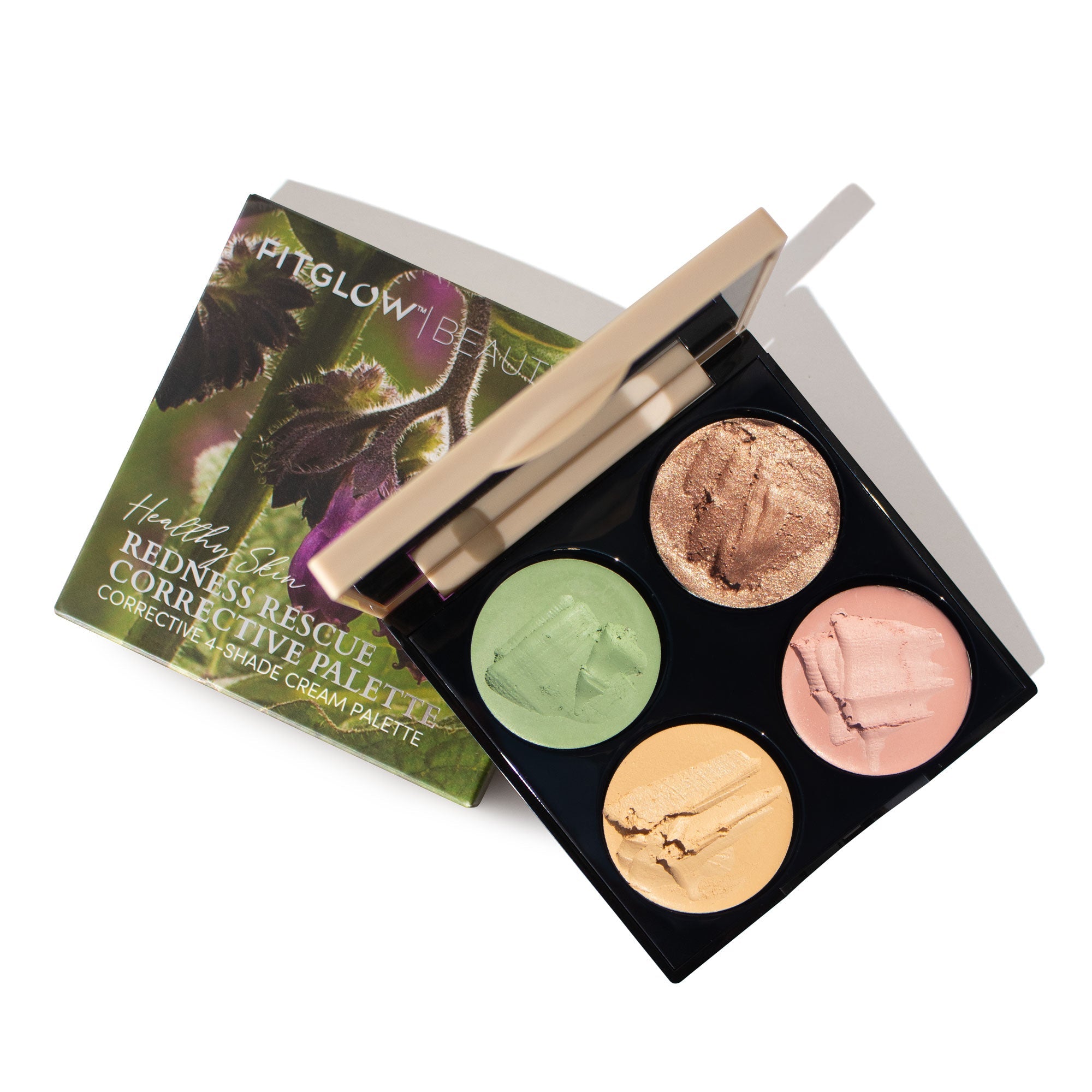Makeup palette with four colors and a branded box on a white background