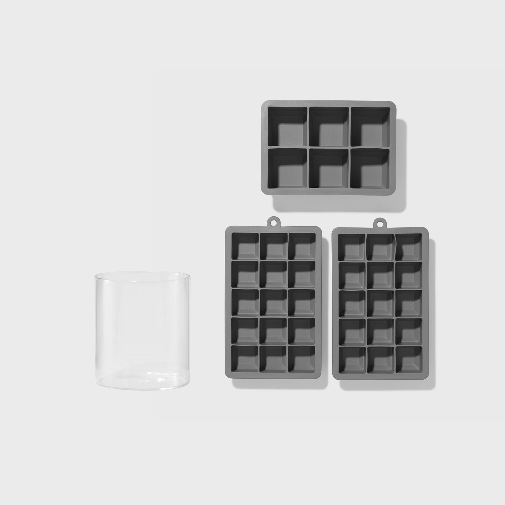 Silicone ice cube tray with lid on a white background