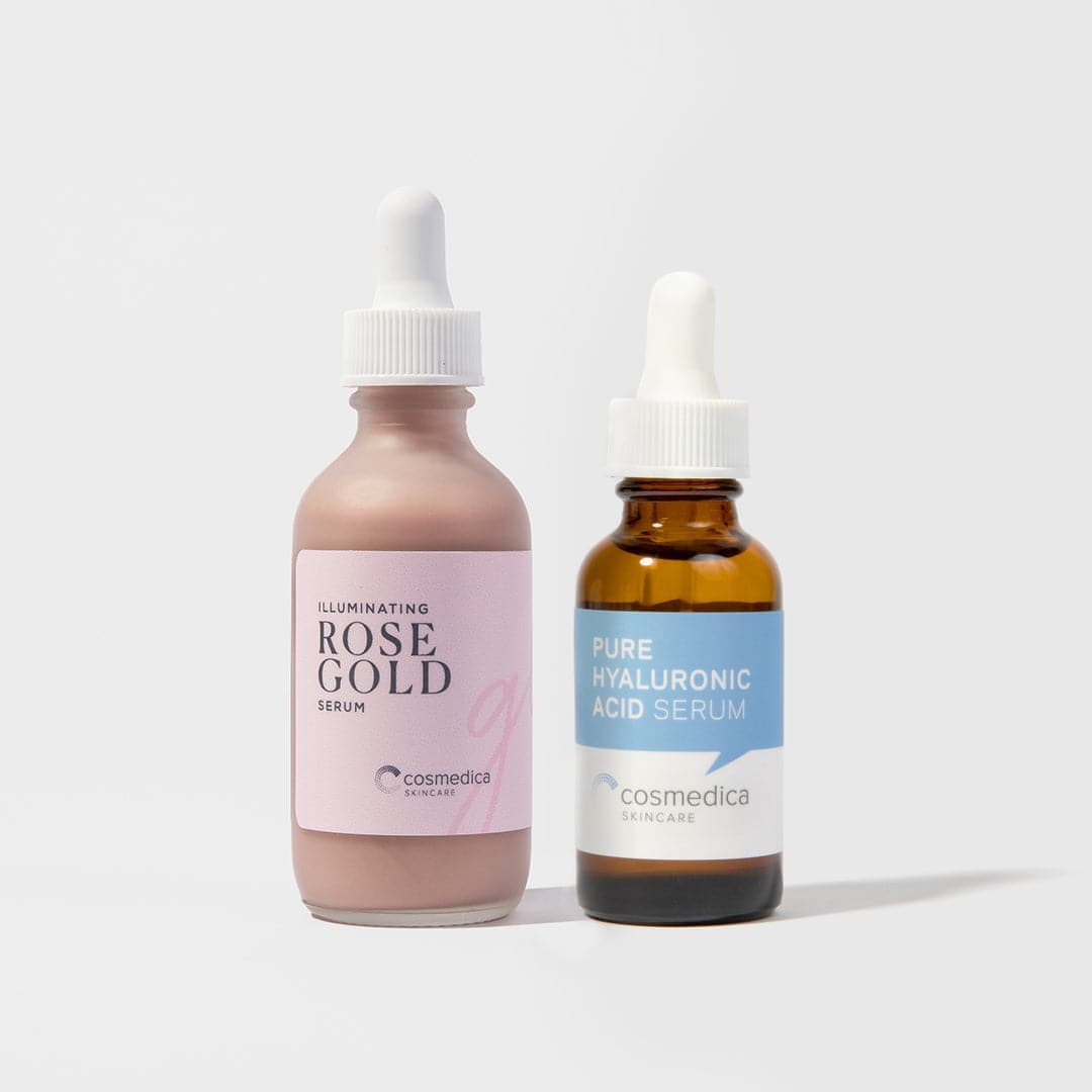 Two skincare serum bottles from cosmedica on a light gray background