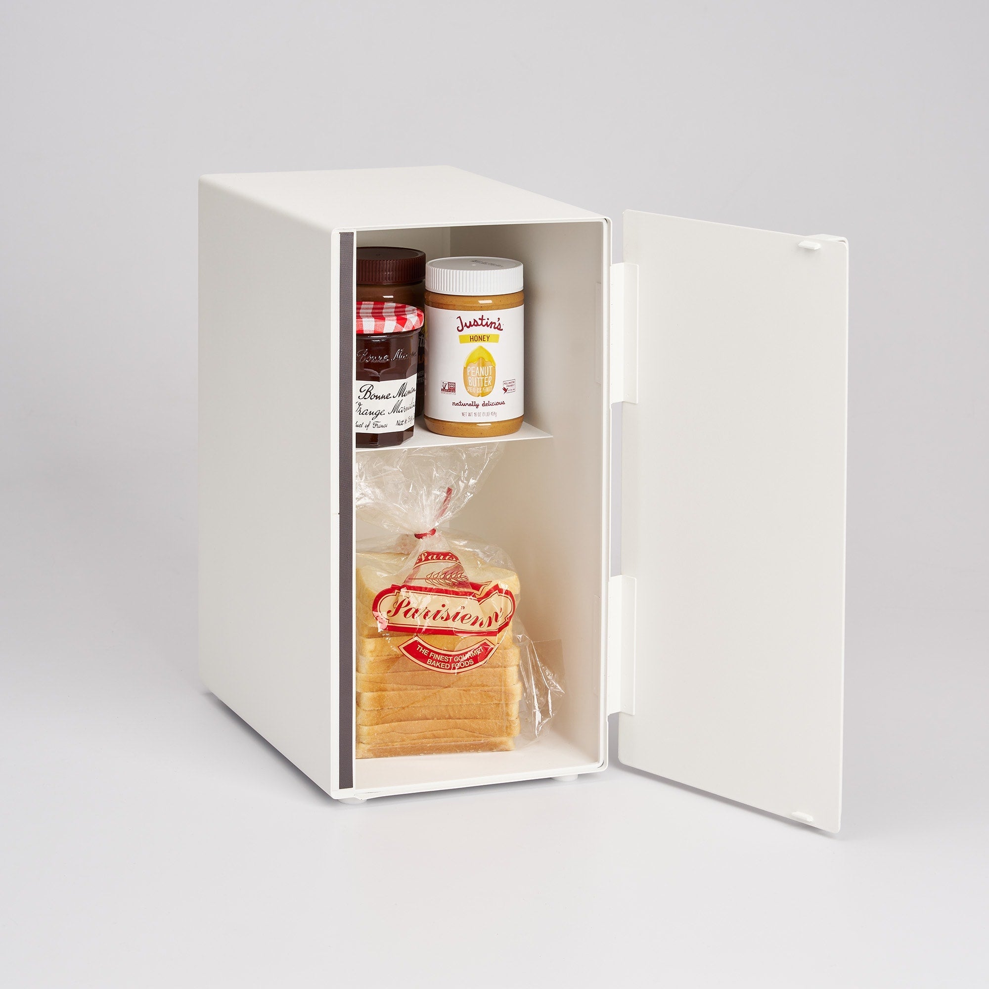 White storage box with food items including bread, jam, and peanut butter on a light gray background