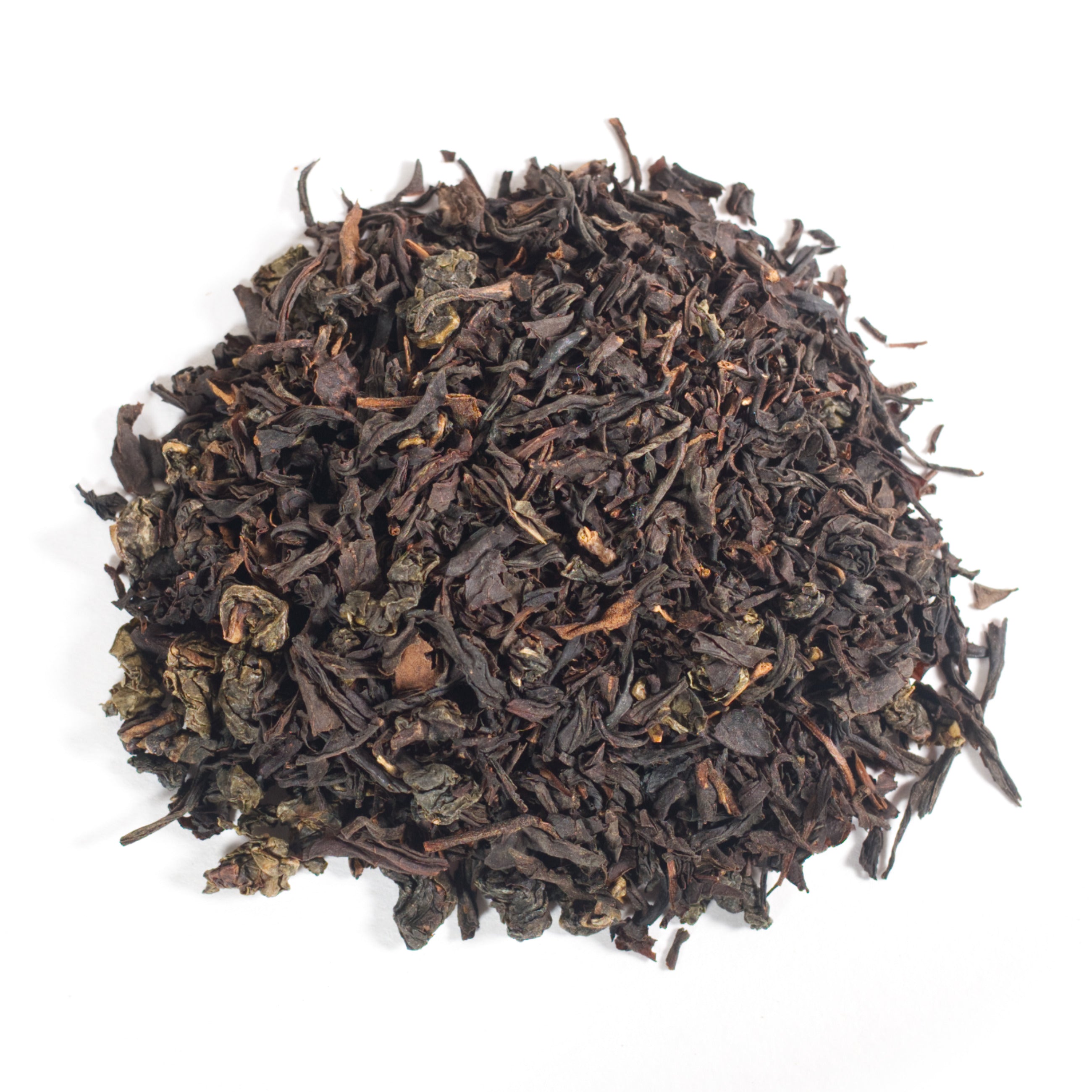 Dry black tea leaves on a white background