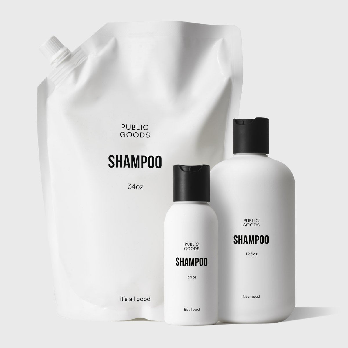 Set of Public Goods shampoo products including a large pouch and two bottles on a white background.