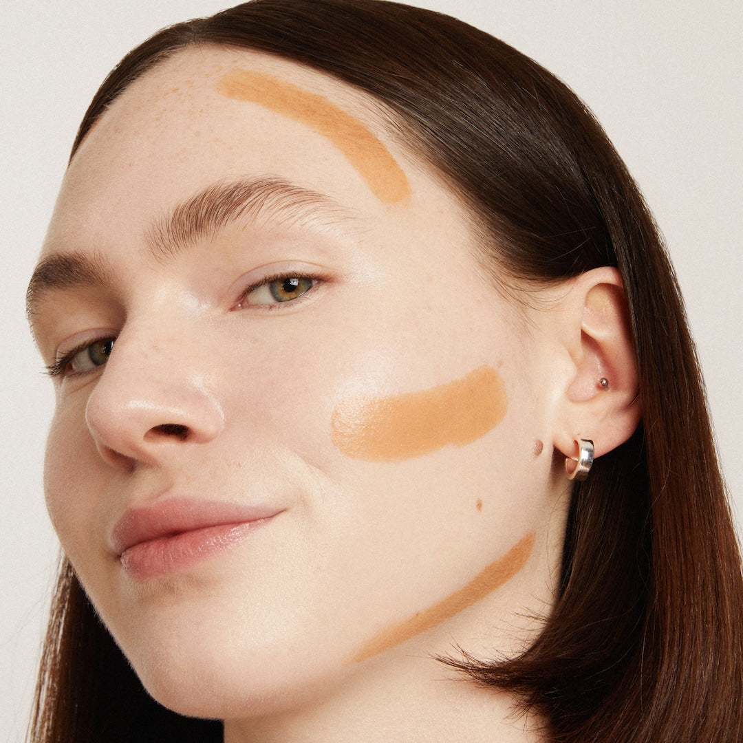 Woman's face with makeup示范区 on a neutral background