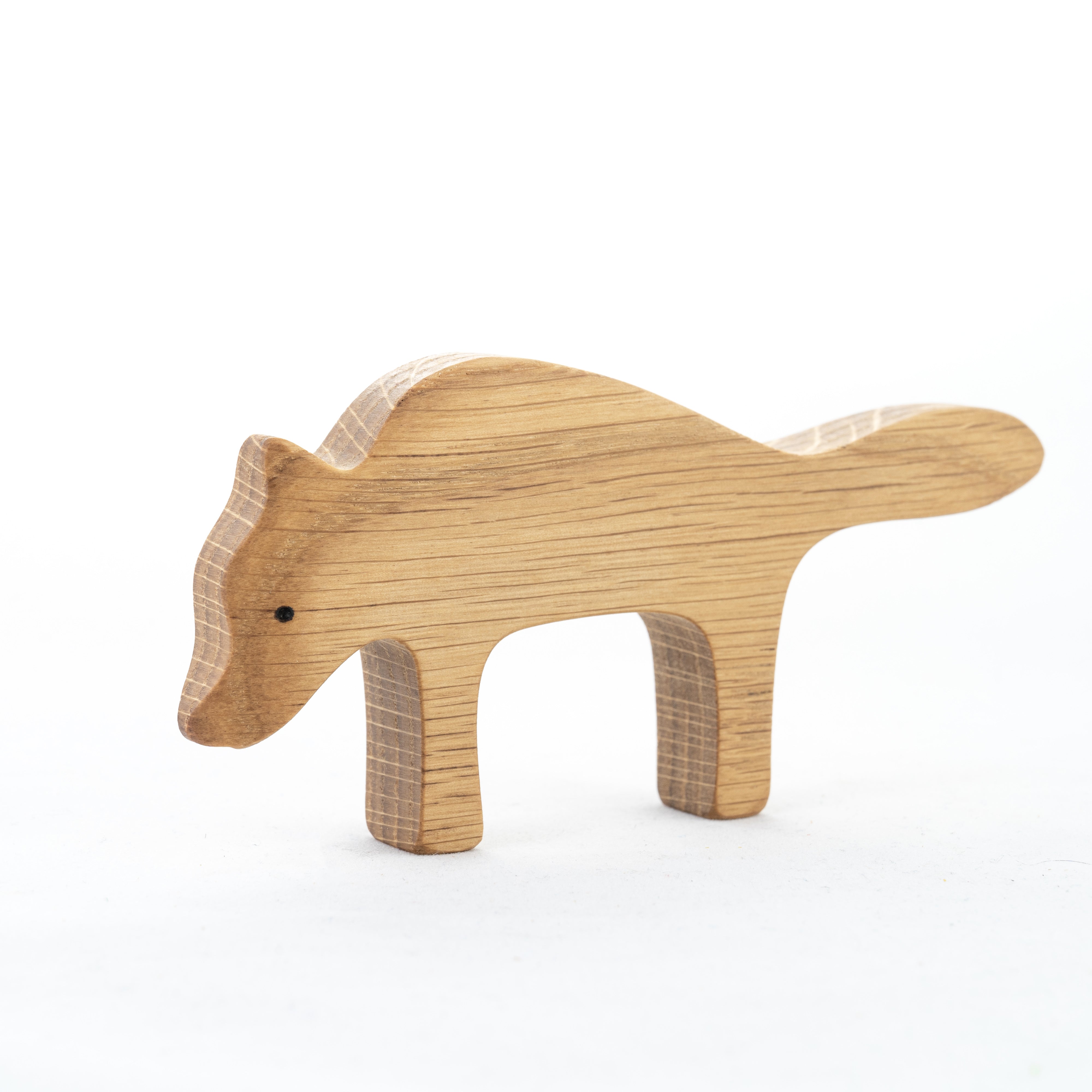 Wooden toy wolf on a white background
