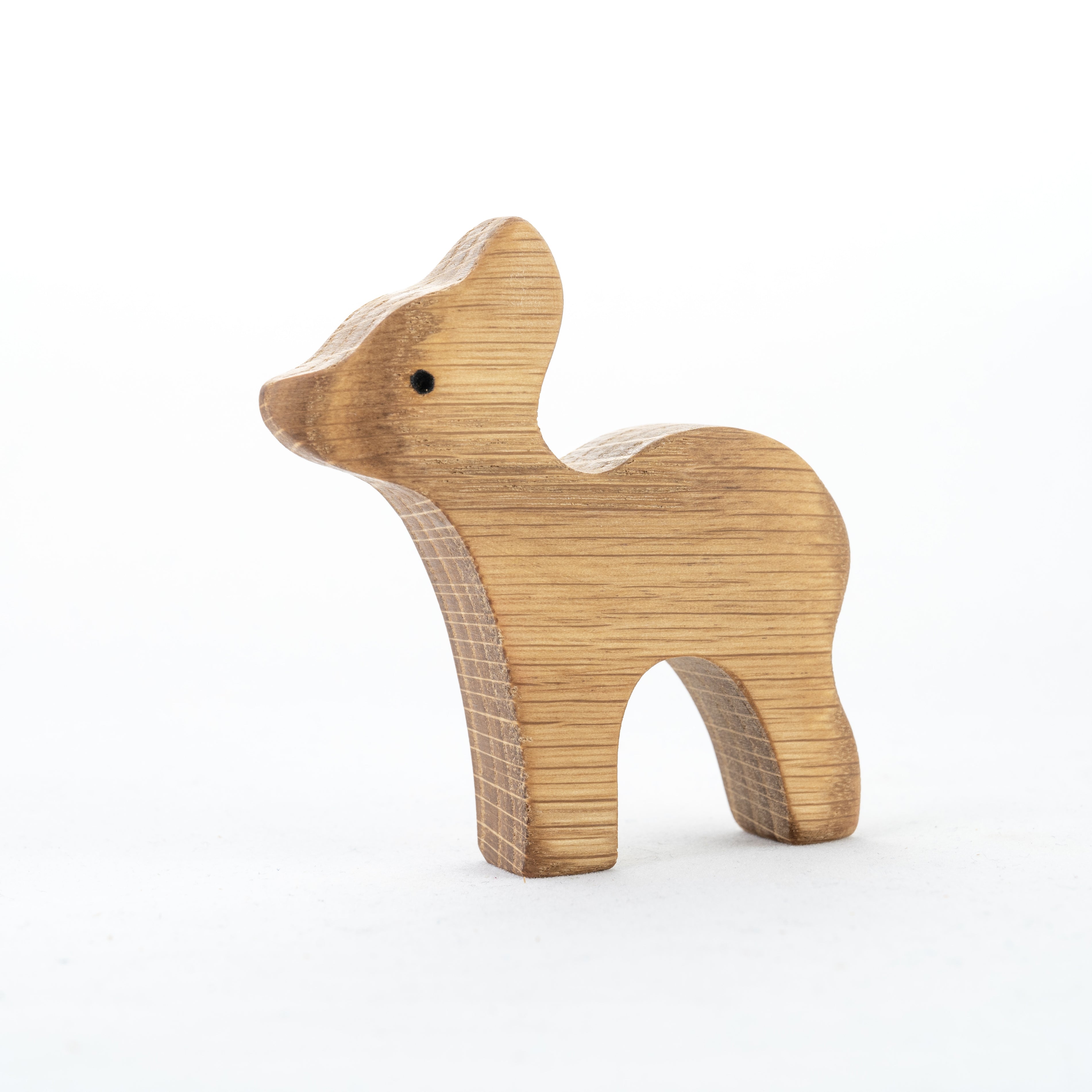 Wooden deer figurine on a white background