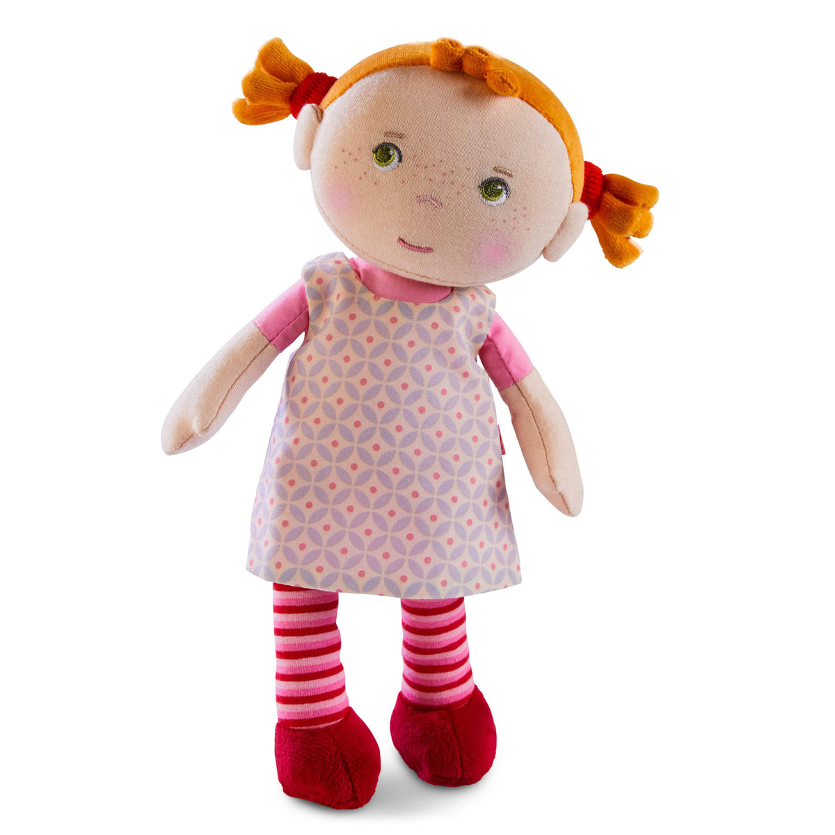 Stuffed doll with red hair, floral dress, and striped socks on a white background