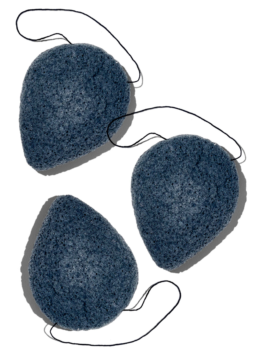 Three blue konjac sponges on a white background