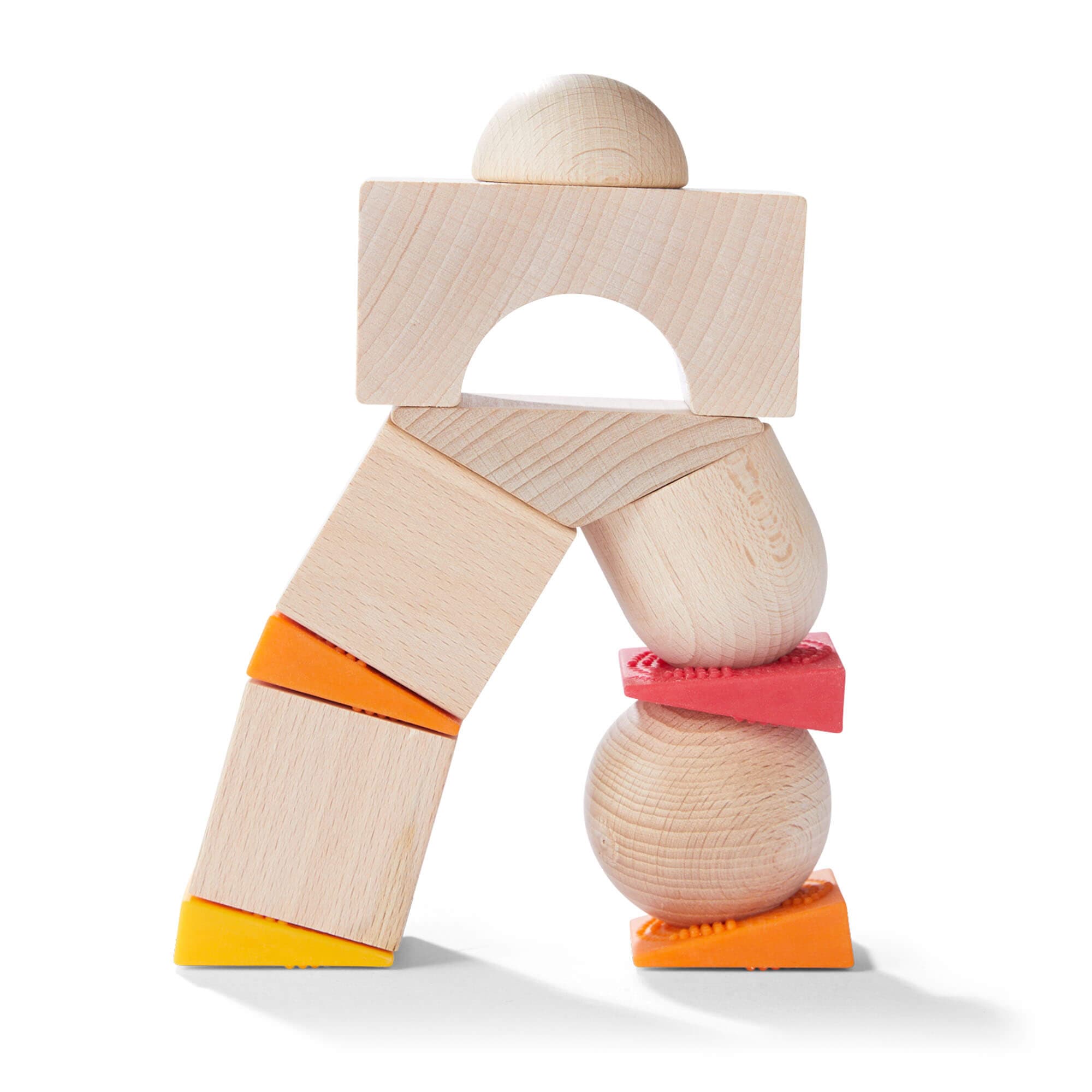 Wooden toy figure with colorful accents on a white background