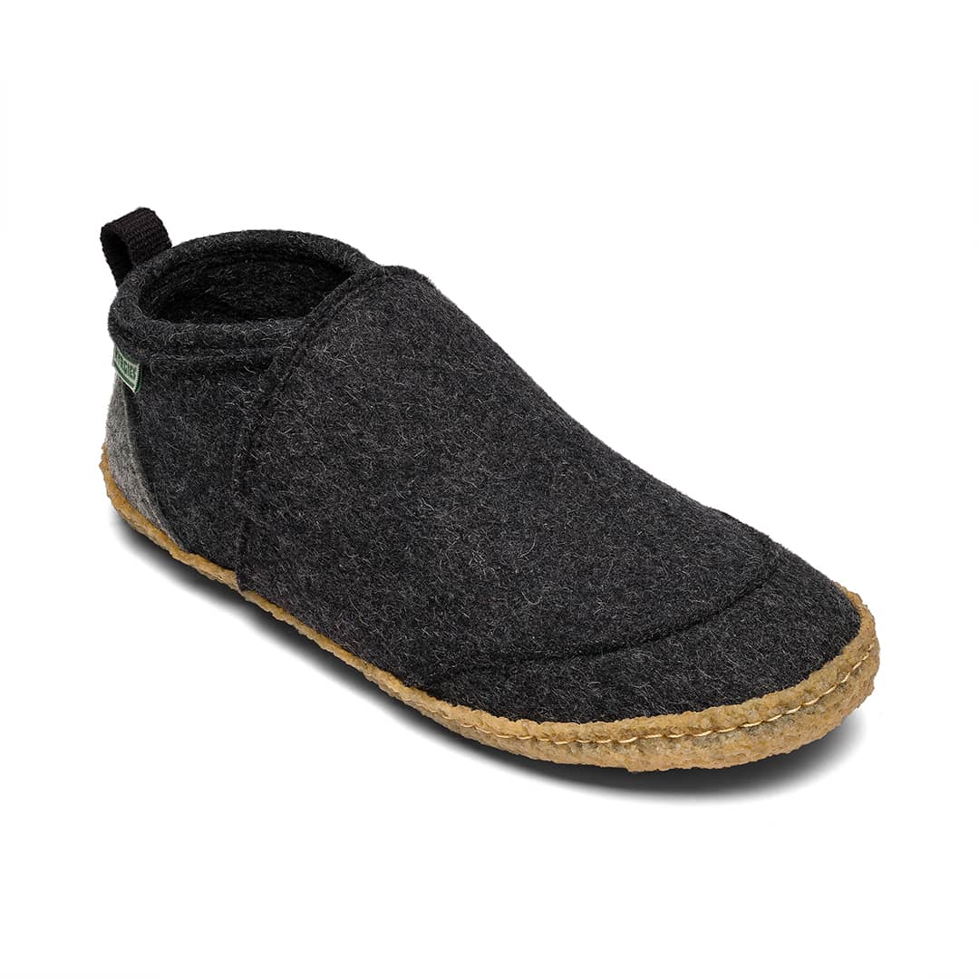 Dark gray slip-on shoe with a cork sole on a white background