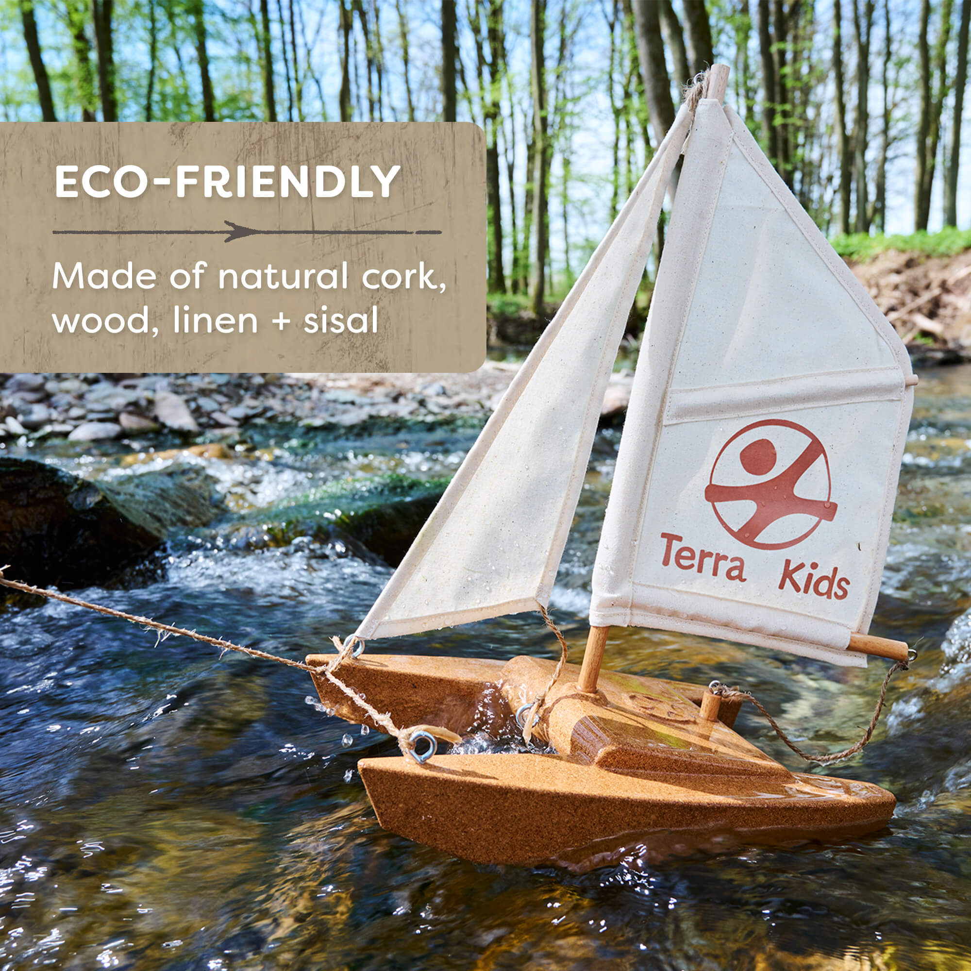 Eco-friendly toy sailboat made of natural materials with 'Terra Kids' branding on a water background.