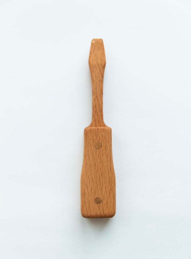 Wooden paddle on a white background