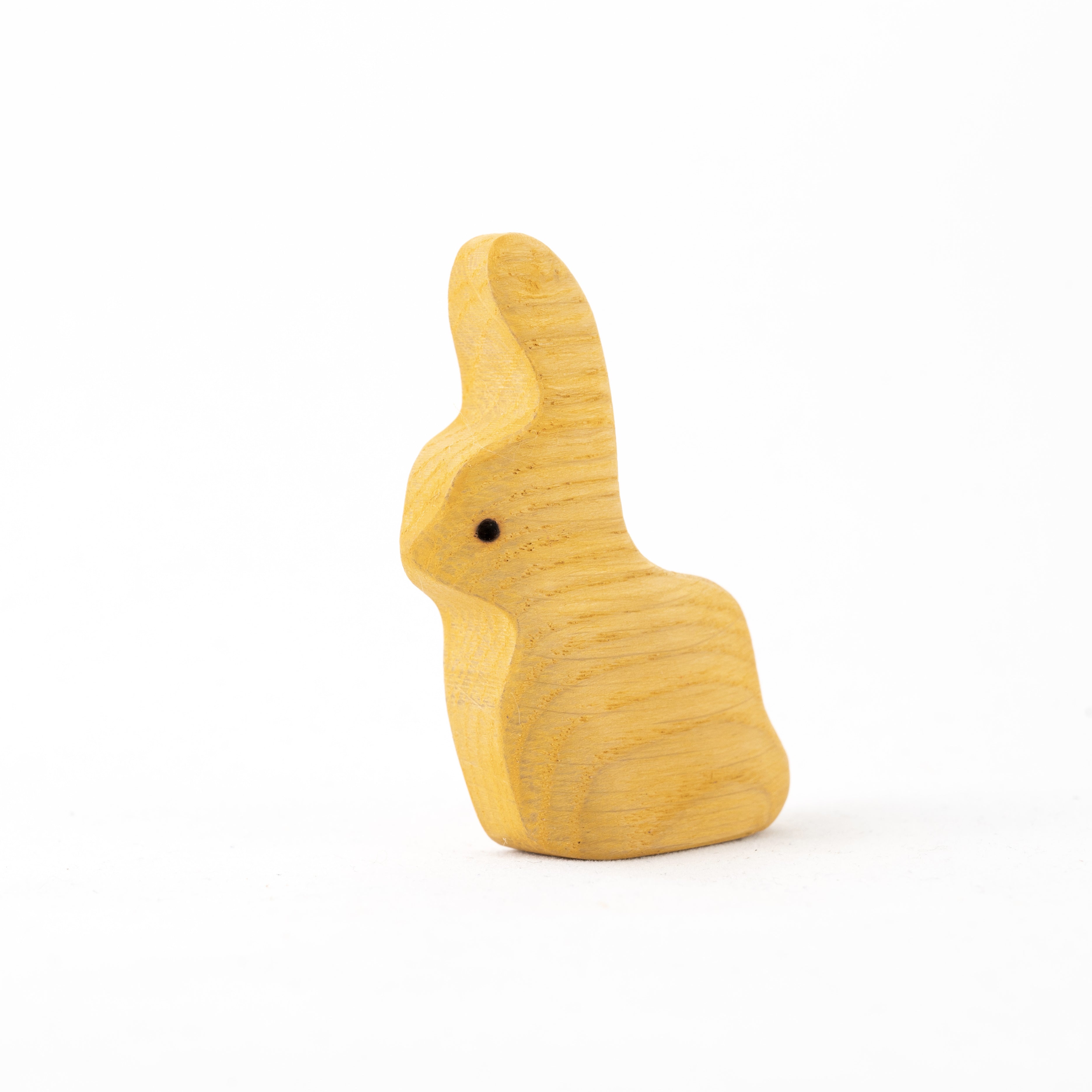 Wooden rabbit-shaped toy on a white background