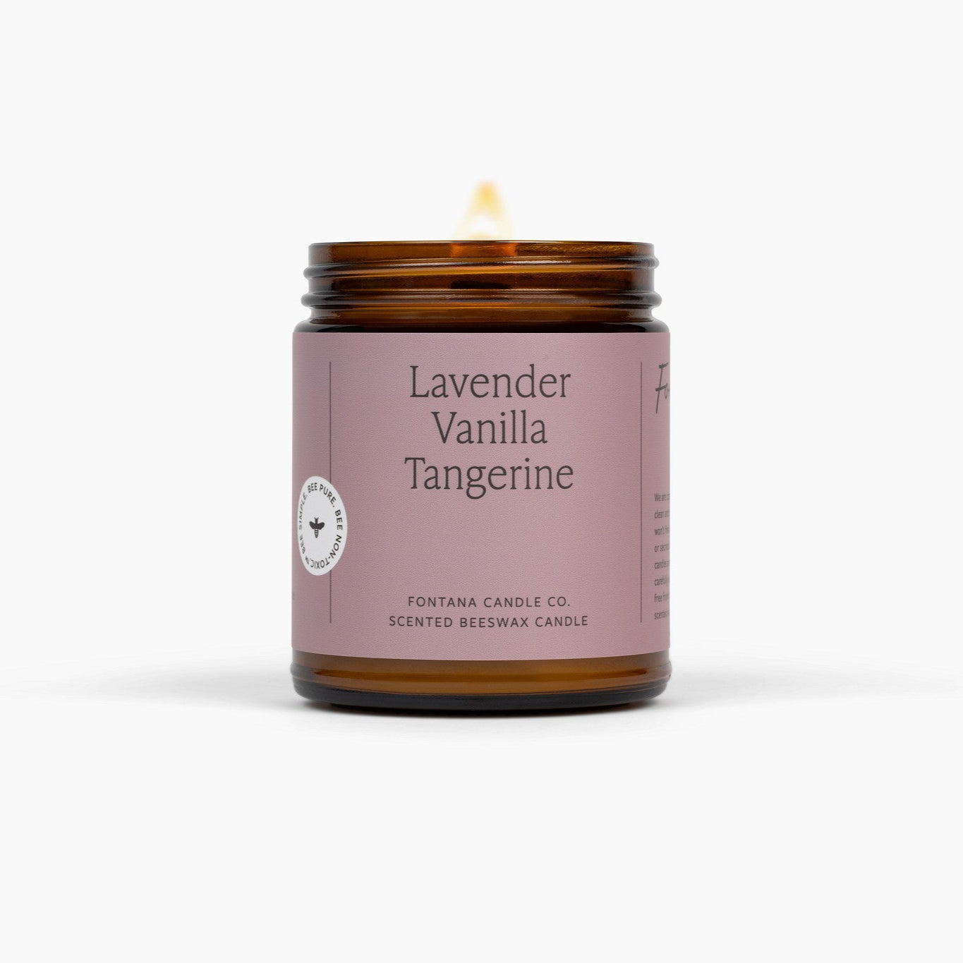 Candle with a lavender label on a white background