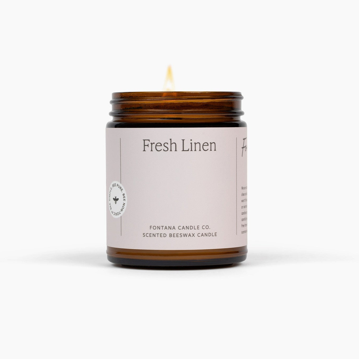 Scented candle labeled 'Fresh Linen' by Fontana Candle Co. on a white background