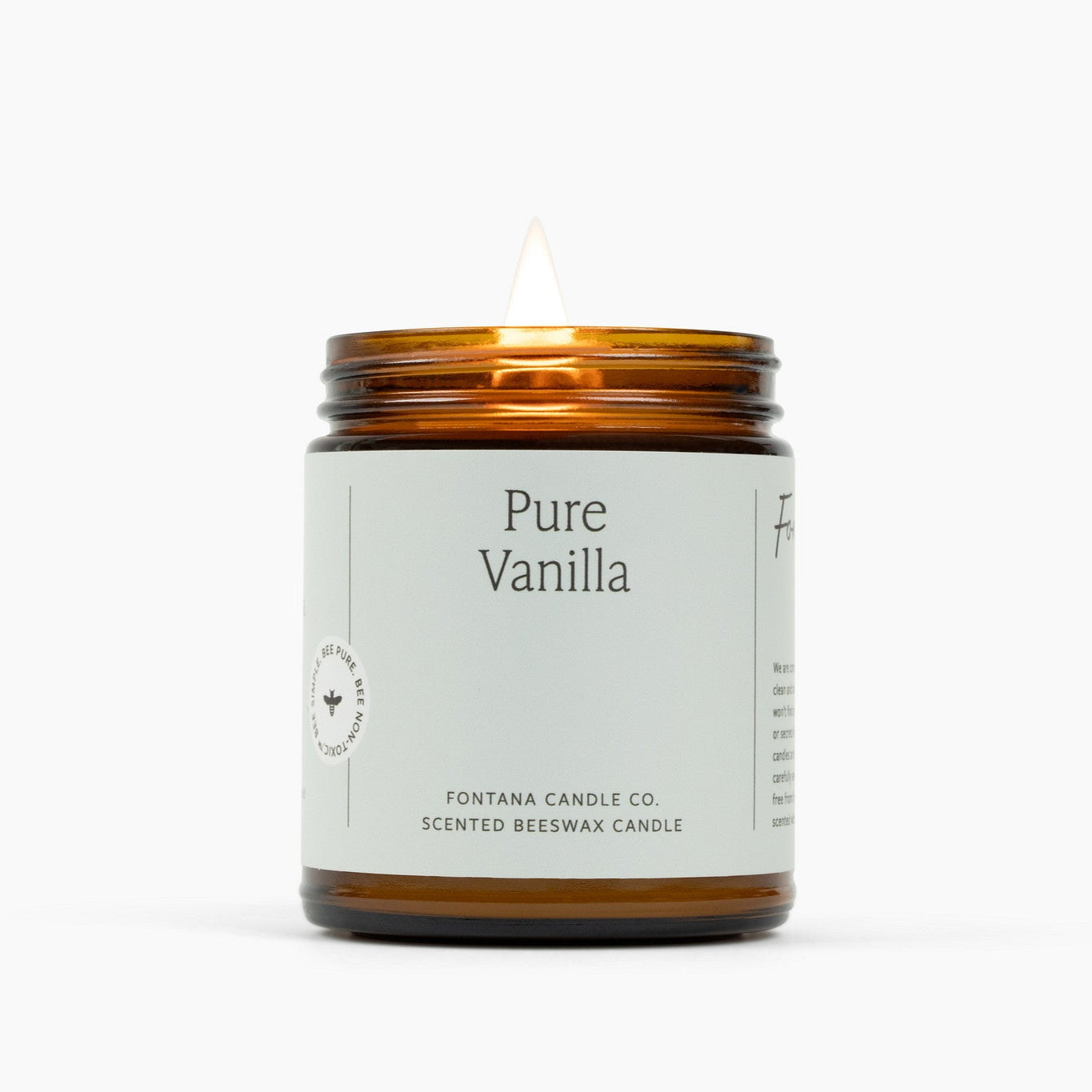 Pure Vanilla scented beeswax candle with a white label on a white background