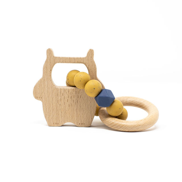 Wooden teething ring with yellow beads and a blue accent on a white background