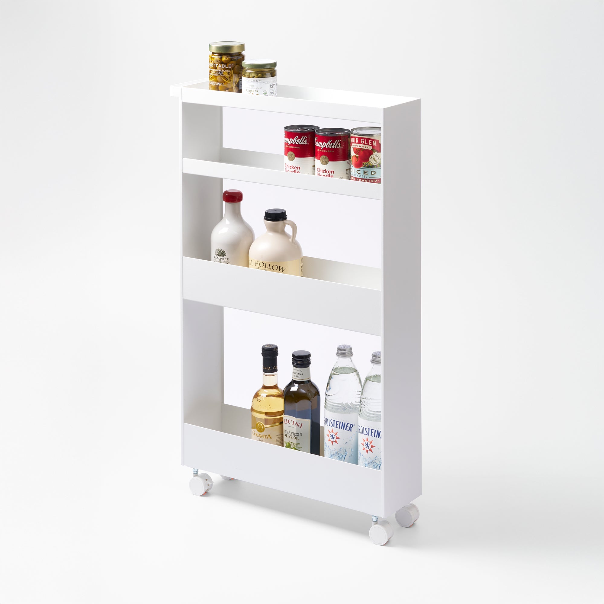 White kitchen storage rack with various items on a white background