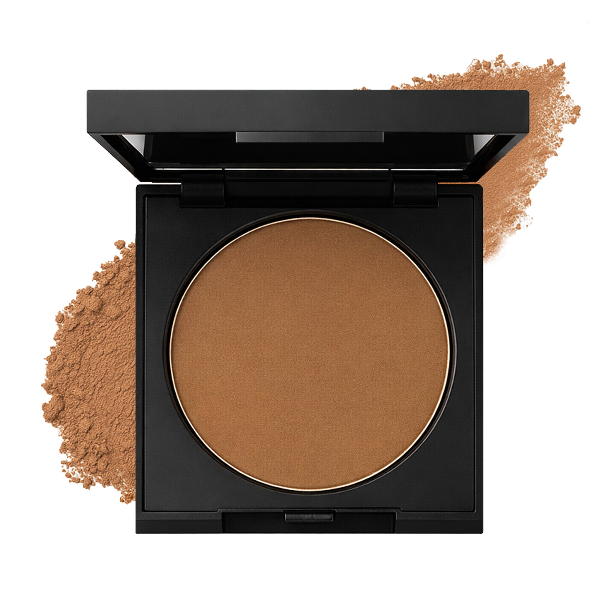 Compact brown powder in a black case with scattered powder on a white background