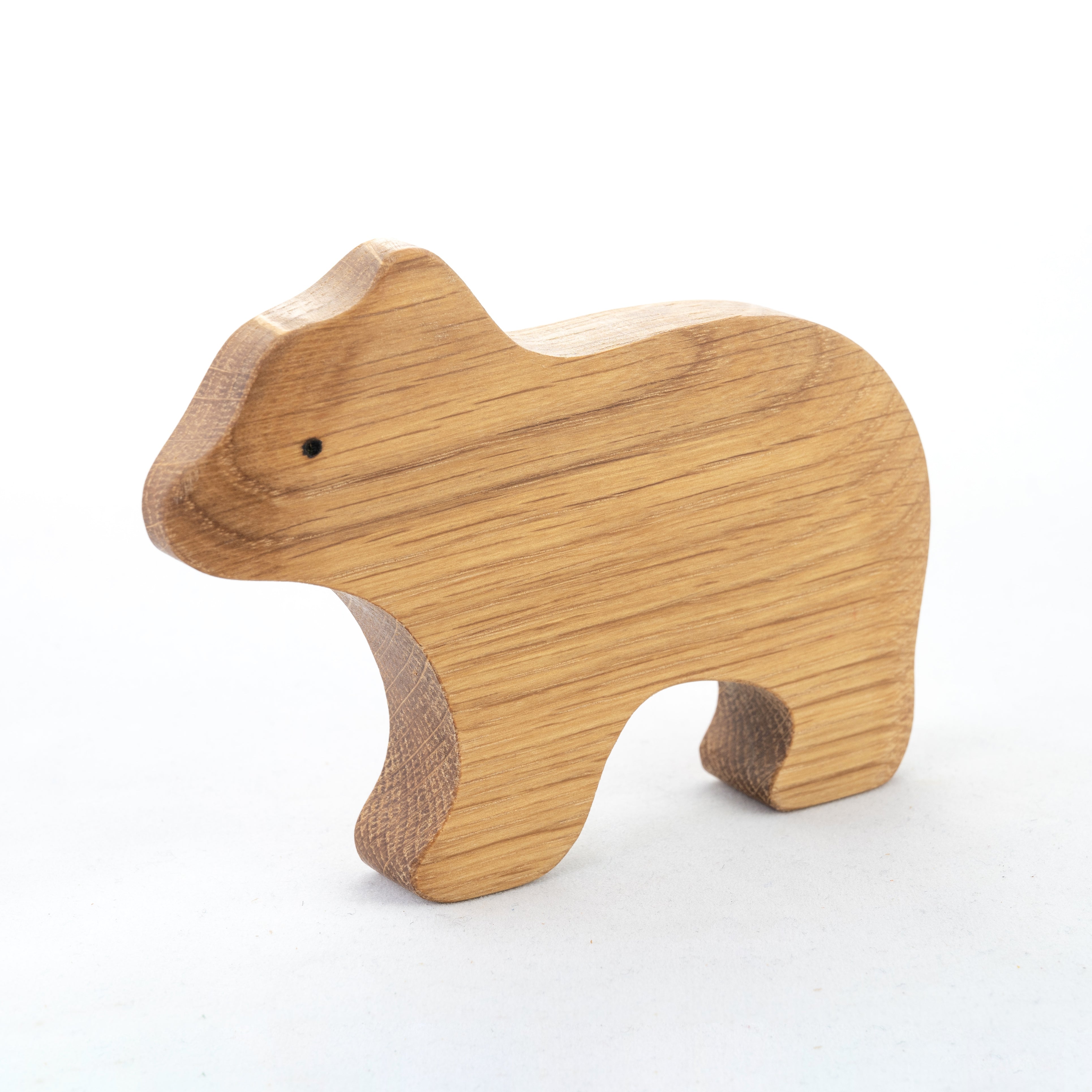 Wooden bear toy on a white background