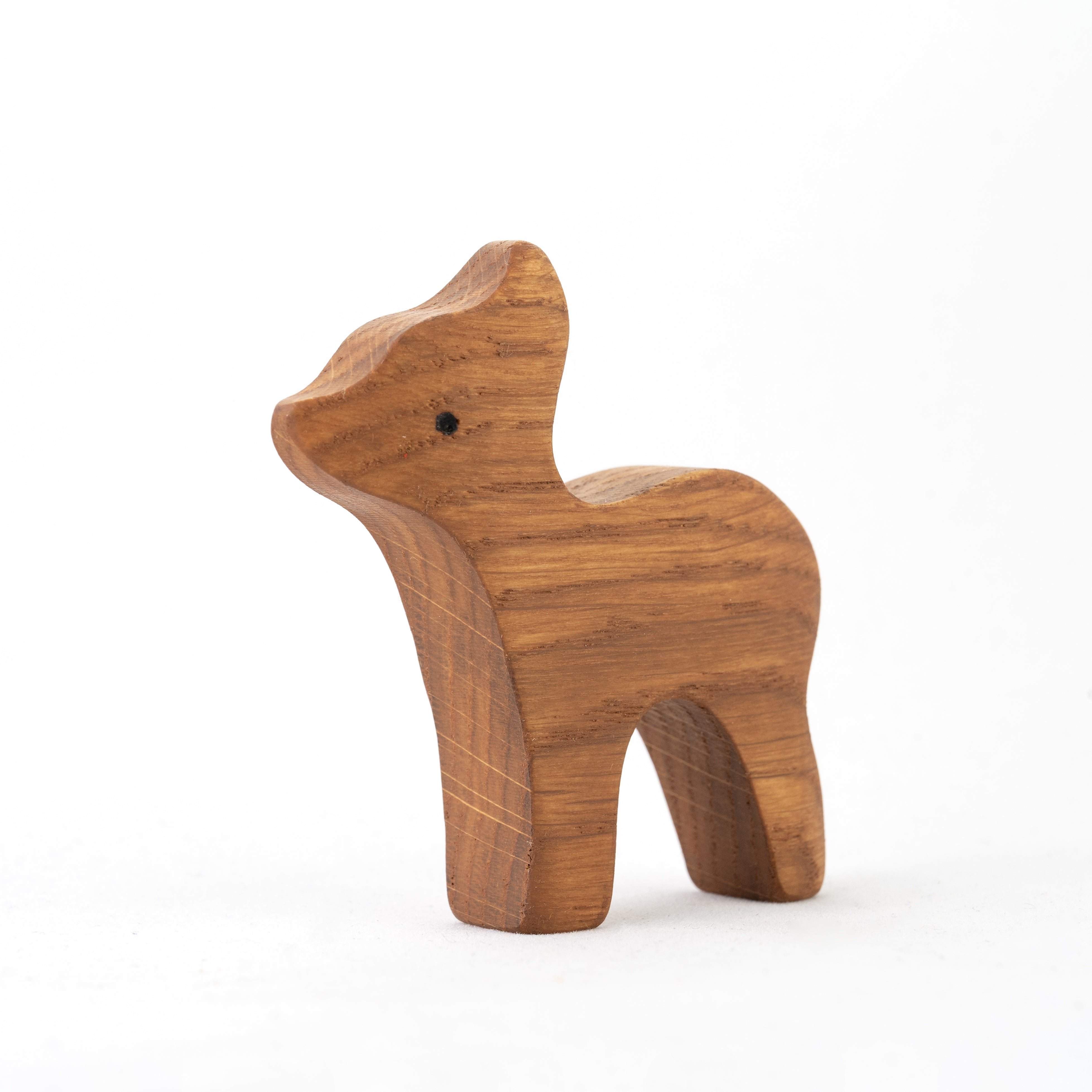 Wooden dog figurine on a white background