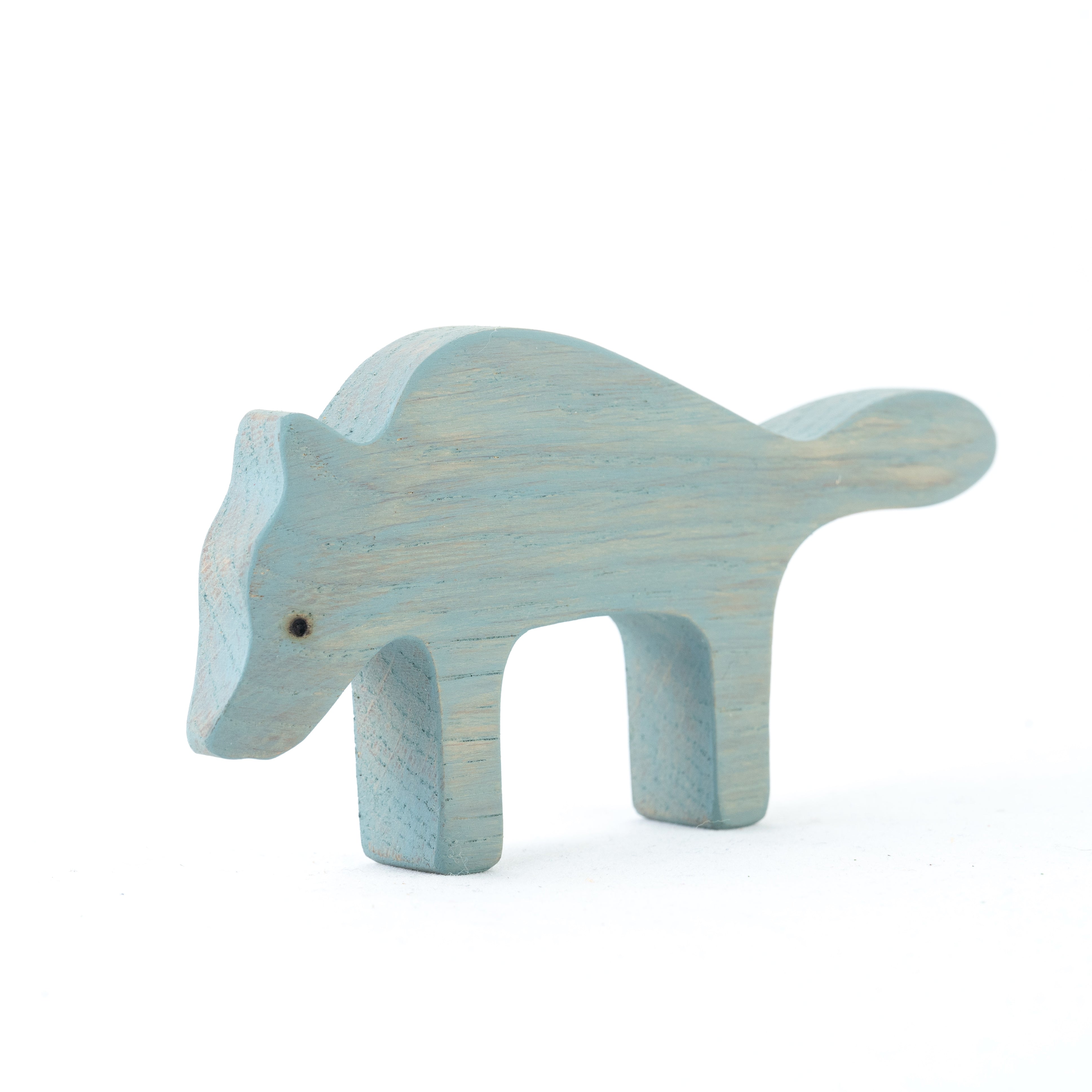 Wooden dinosaur toy figure on a white background