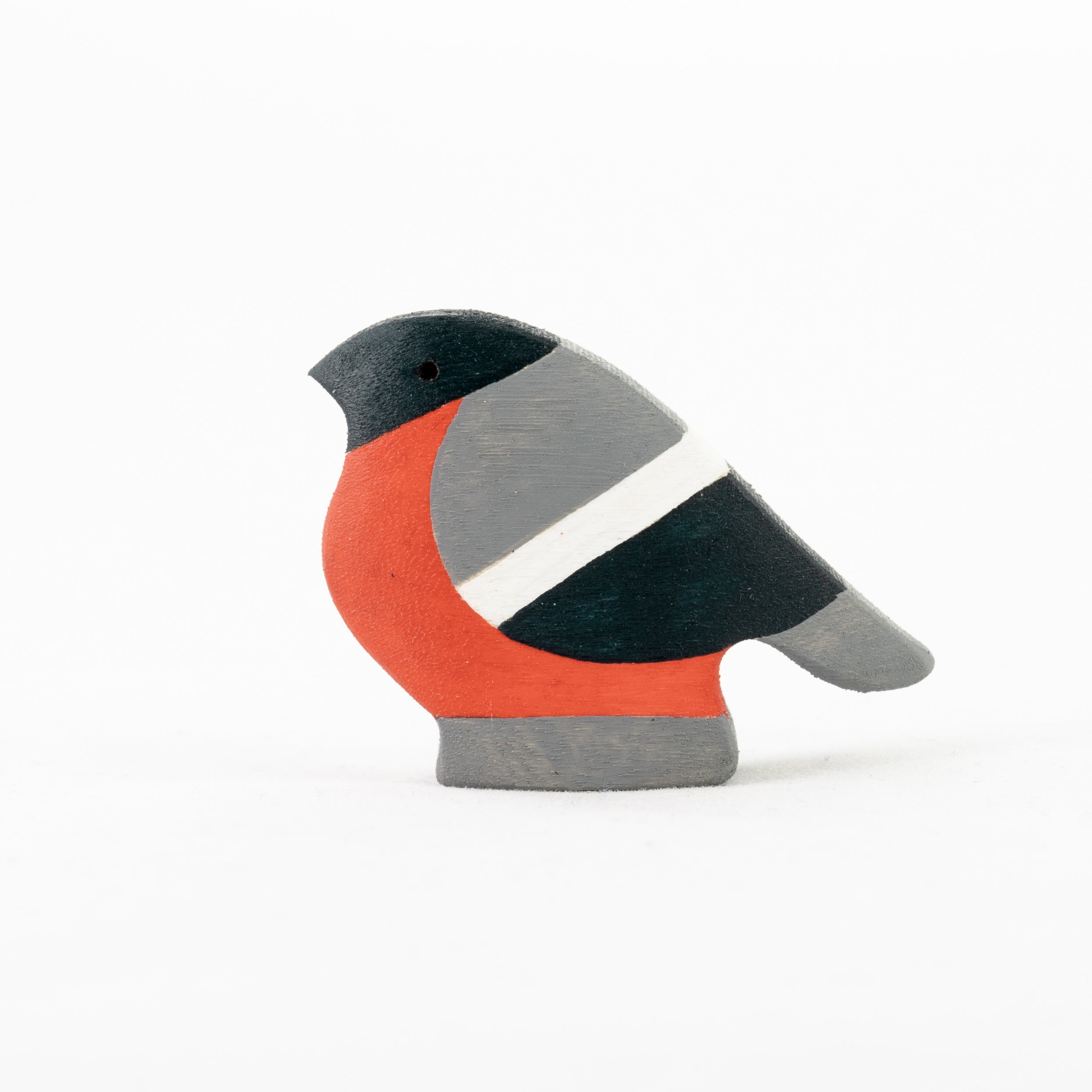 Wooden bird toy with orange, gray, and black colors on a white background