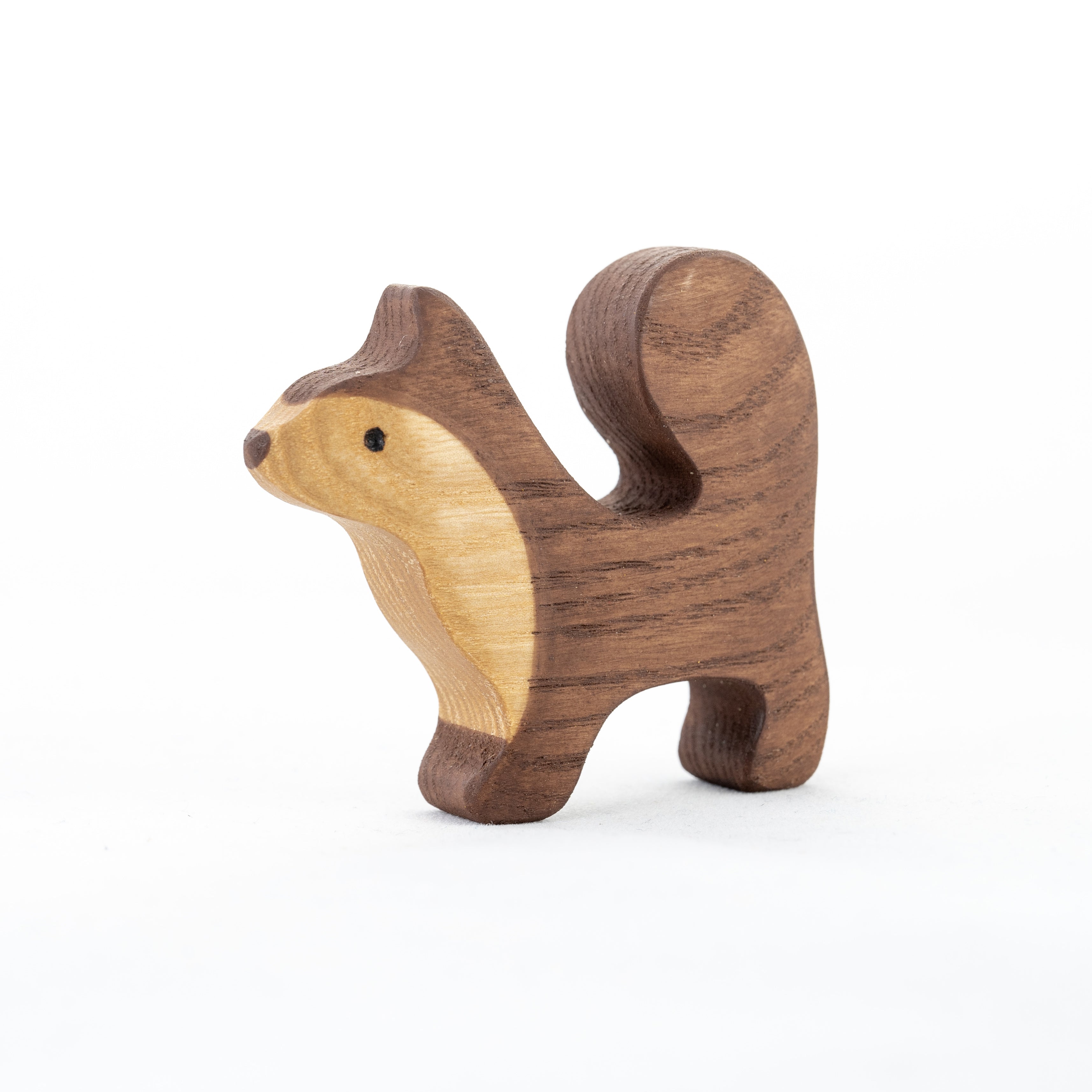 Wooden squirrel figurine on a white background
