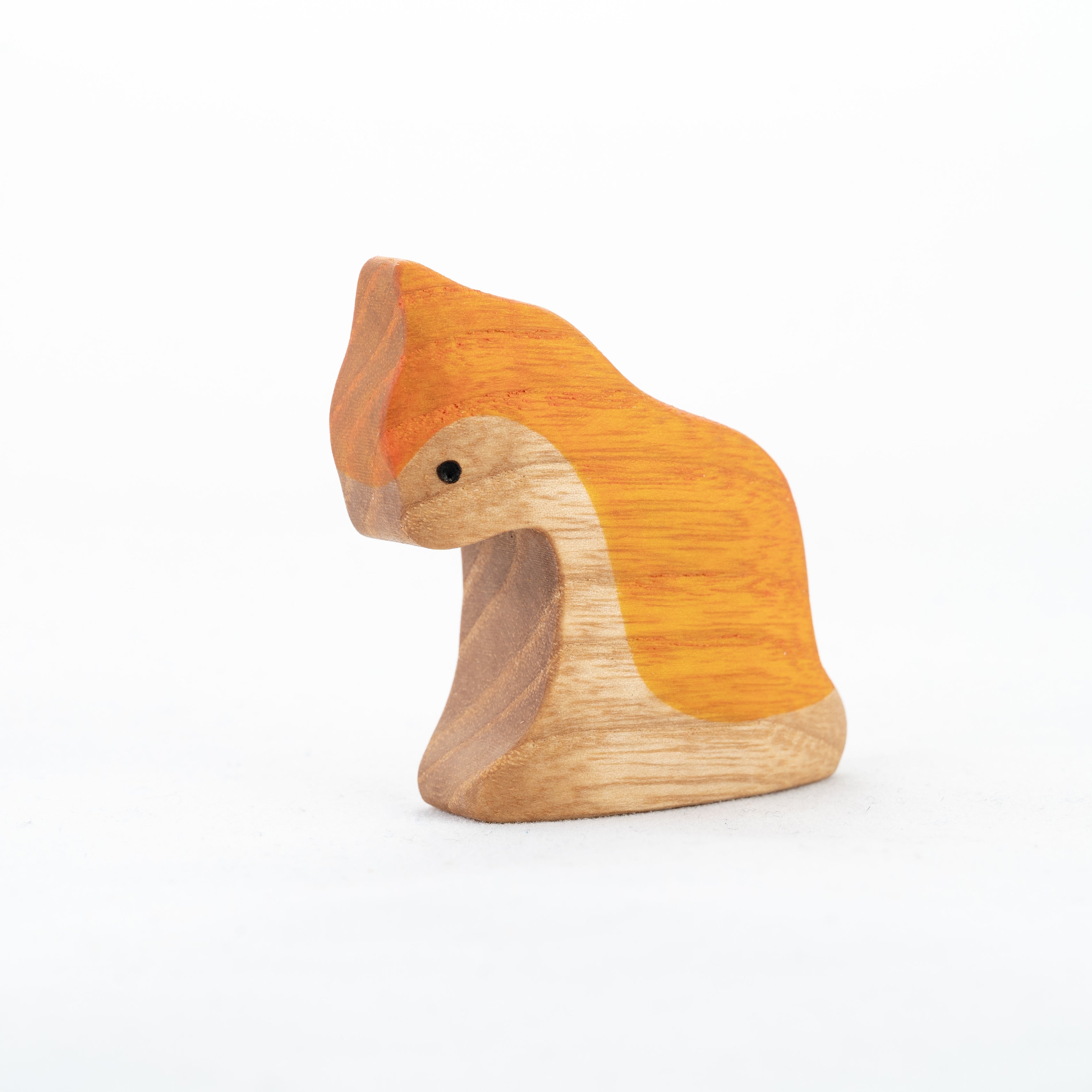 Wooden toy squirrel with orange back and brown body on a white background