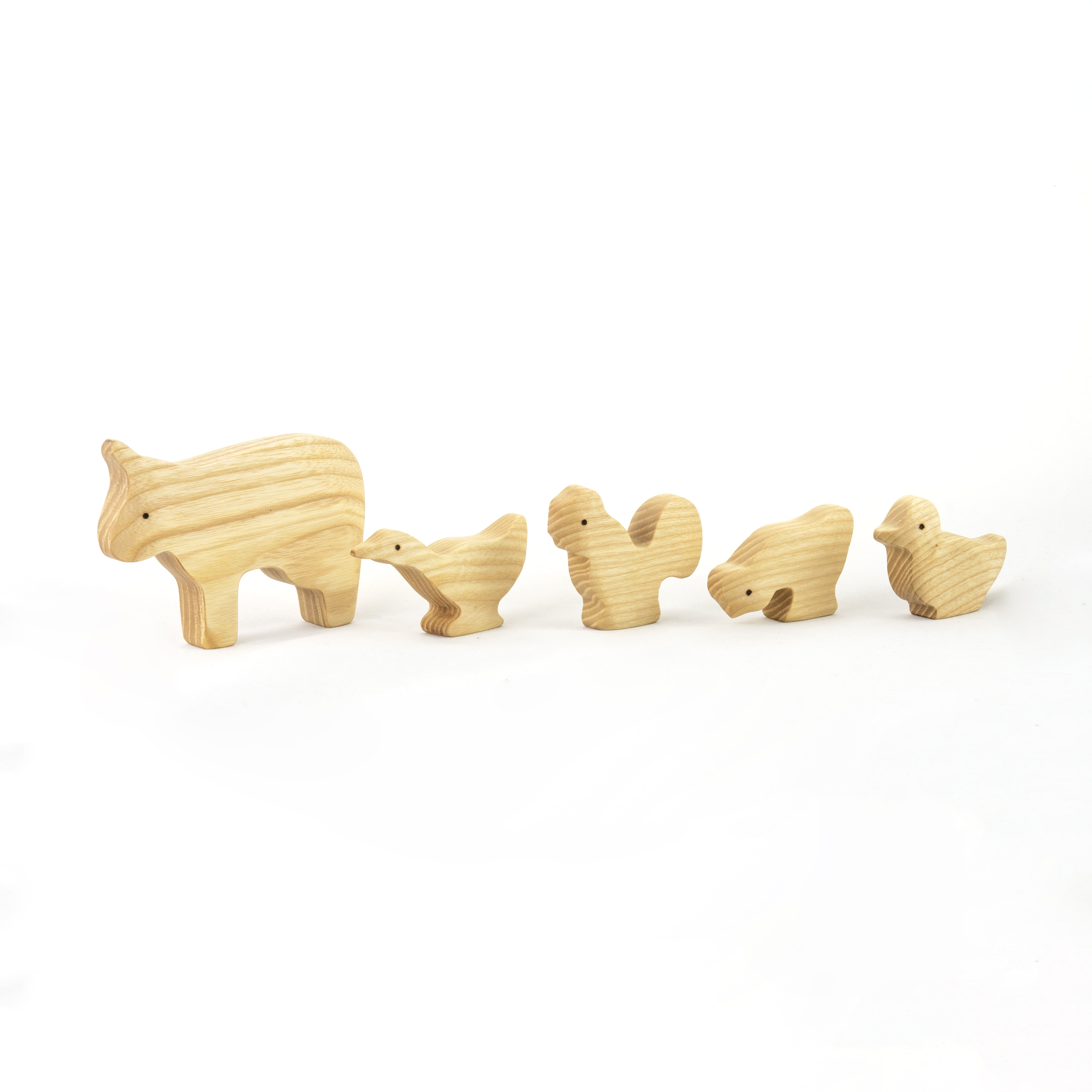 Set of wooden animal figures on a white background