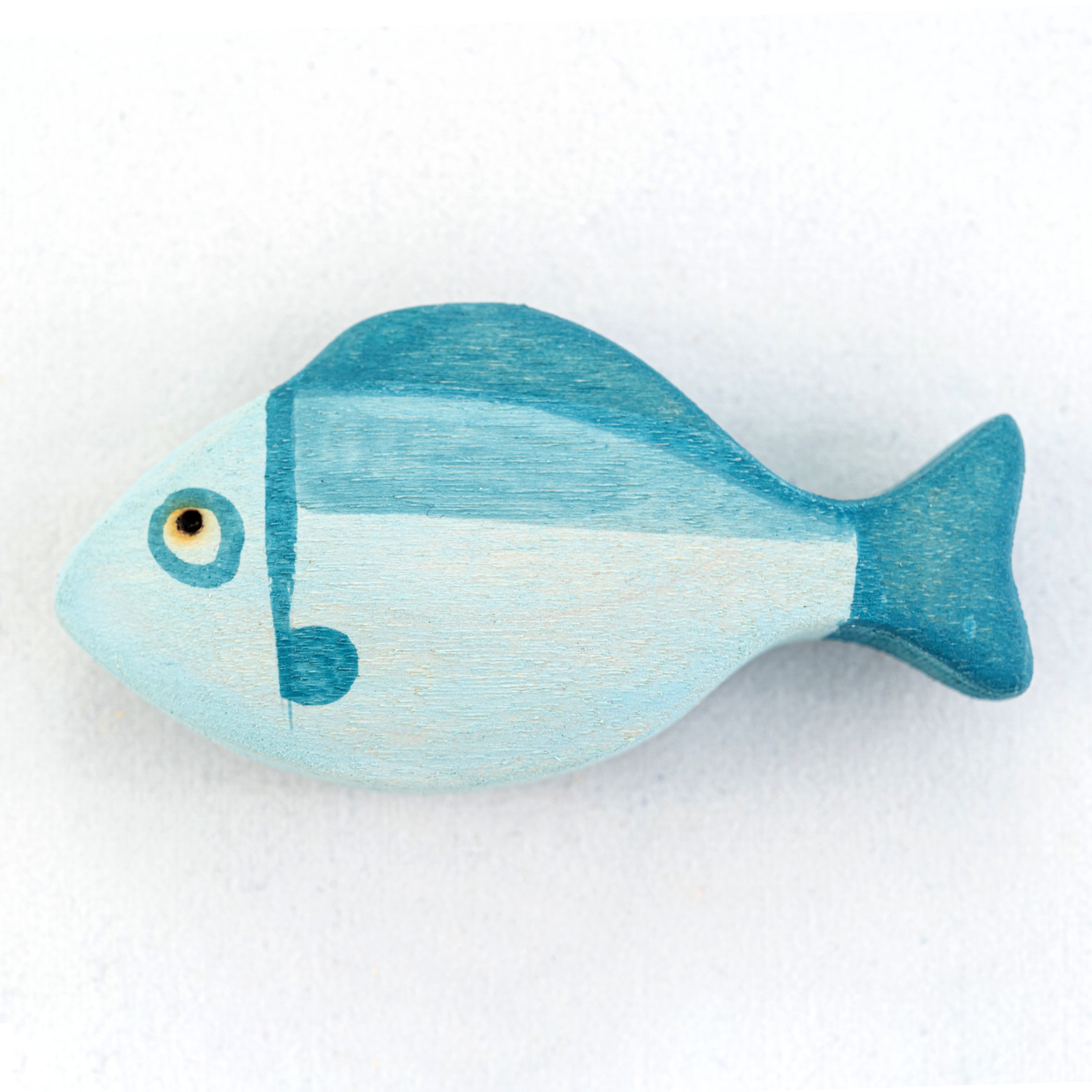 Blue fish-shaped object on a white background