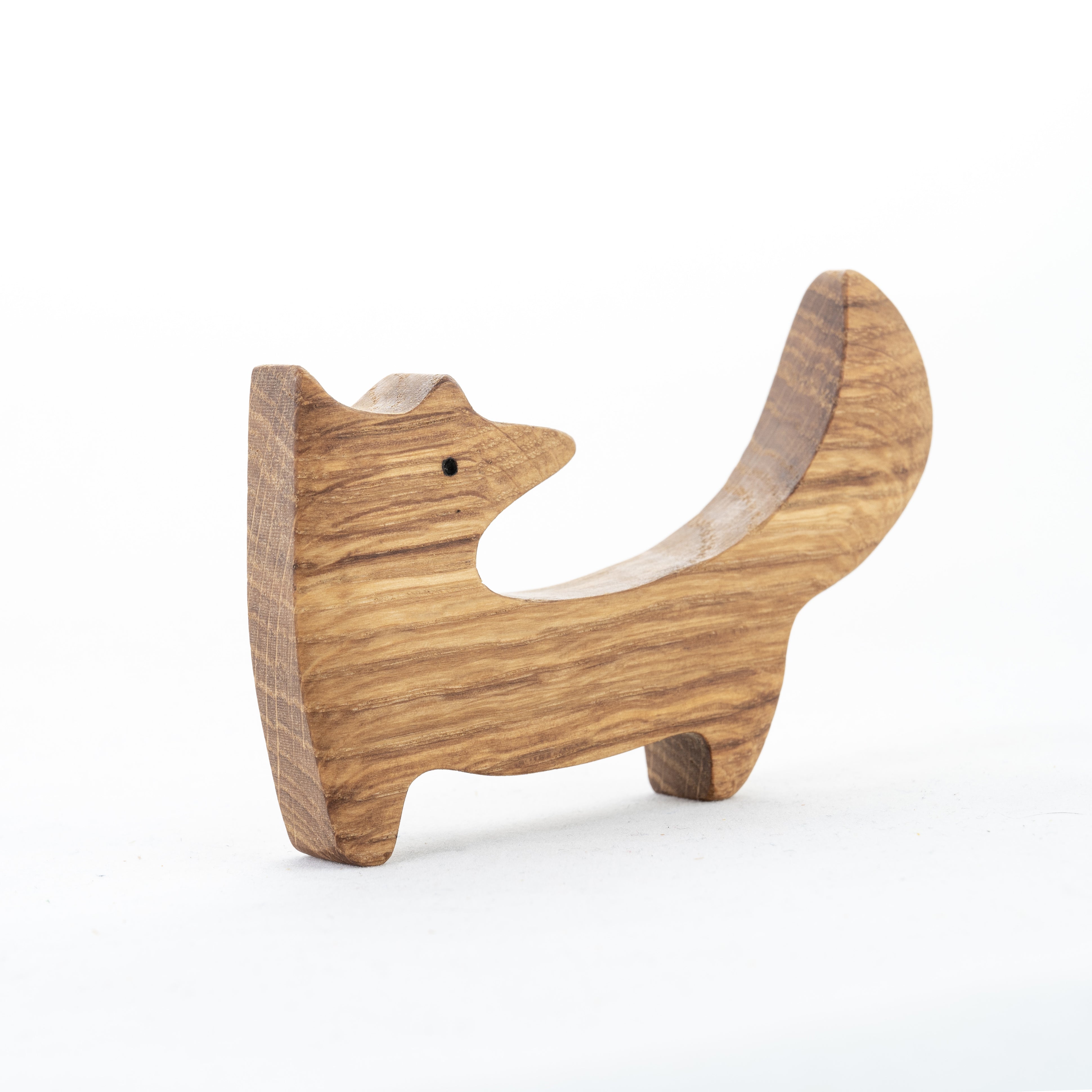 Wooden fox-shaped object on a white background
