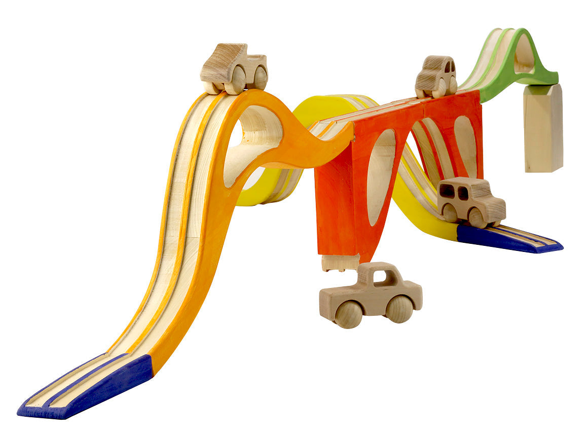 Colorful wooden toy track with cars on a white background