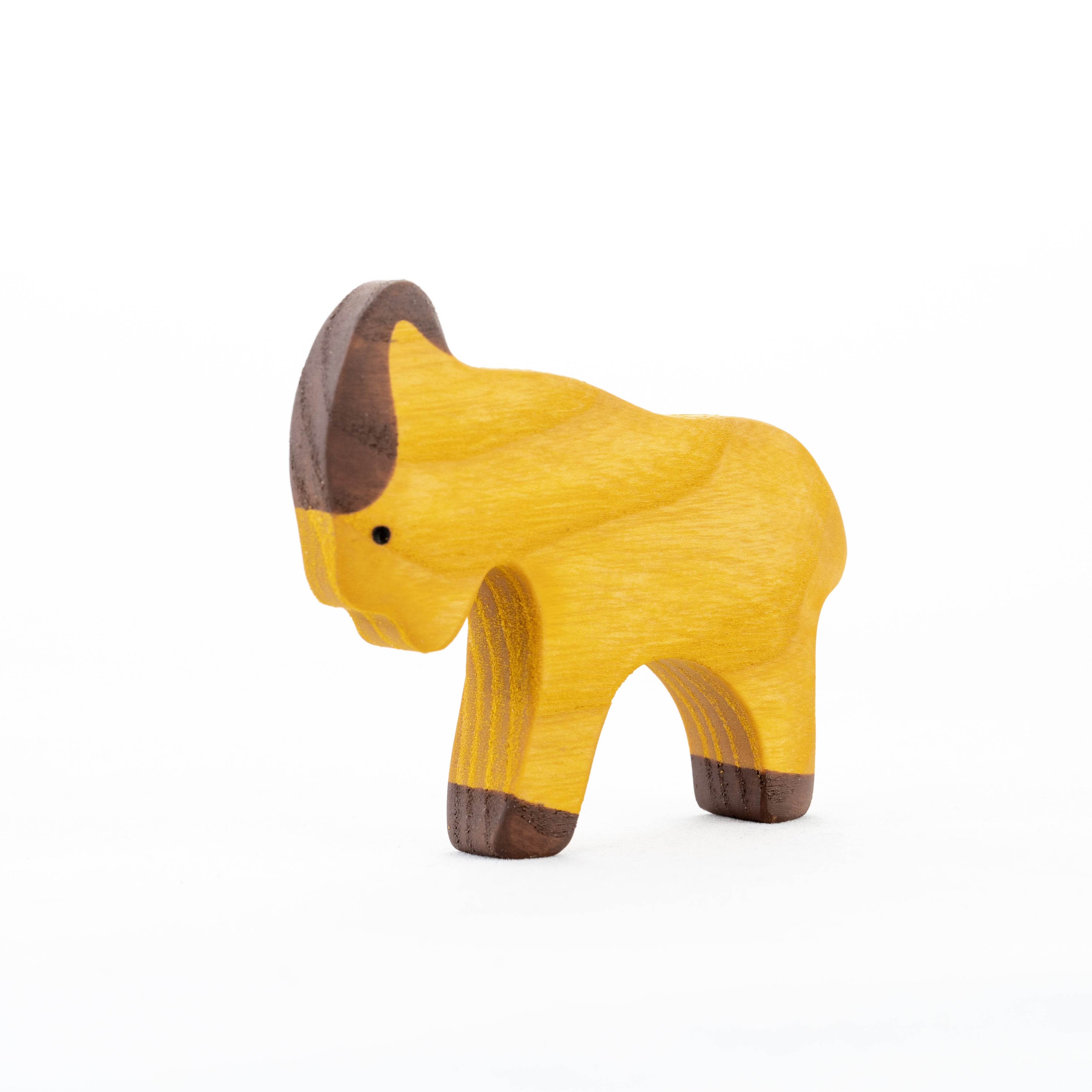 Wooden toy buffalo figure on a white background