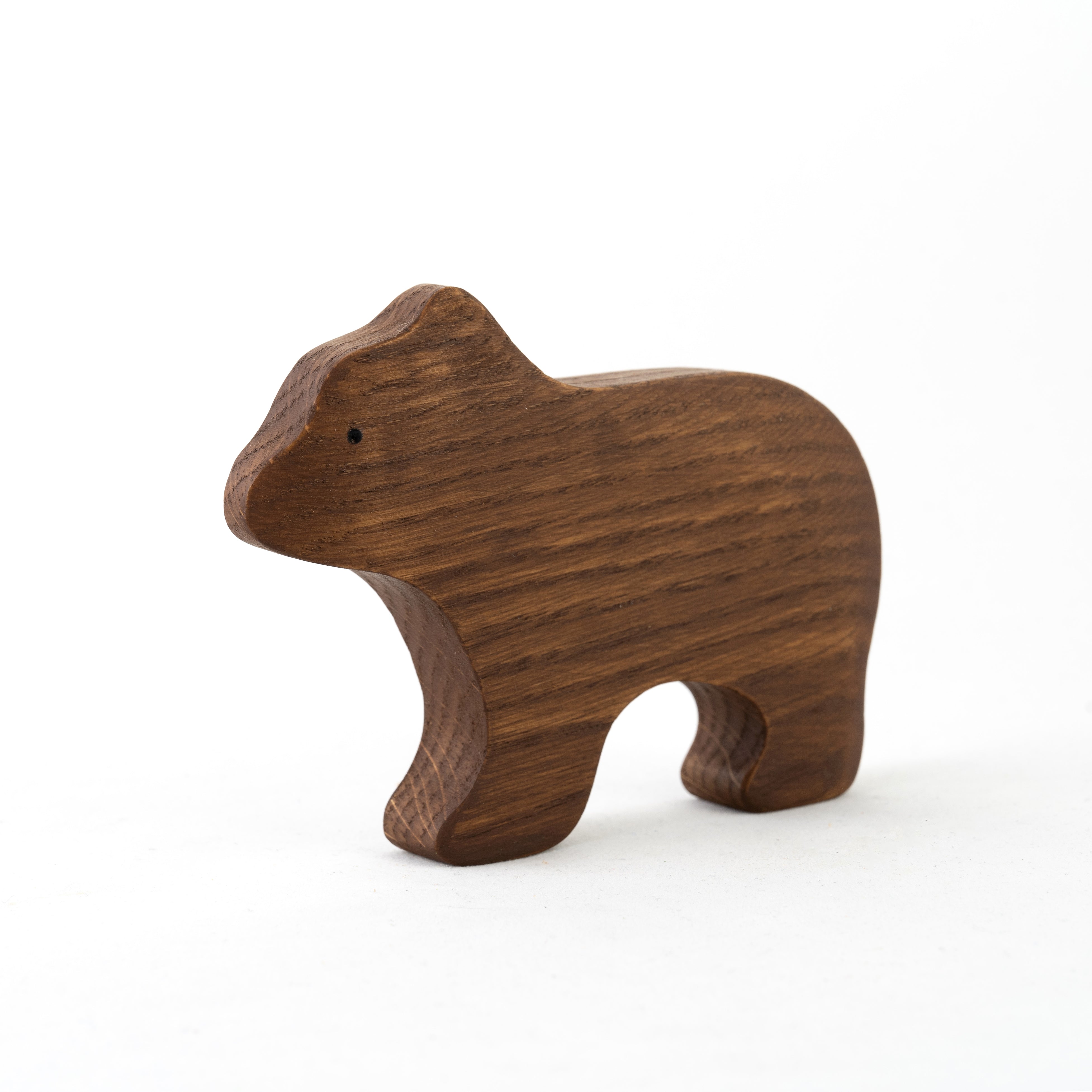 Wooden bear figurine on a white background