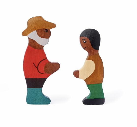 Wooden figurines of a man and a woman on a white background
