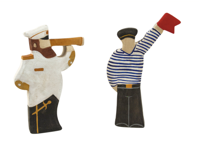 Two decorative figurines of a sailor and a mariner on a white background