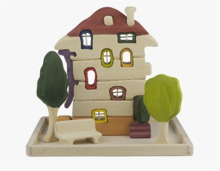 Colorful toy house with trees on a white background