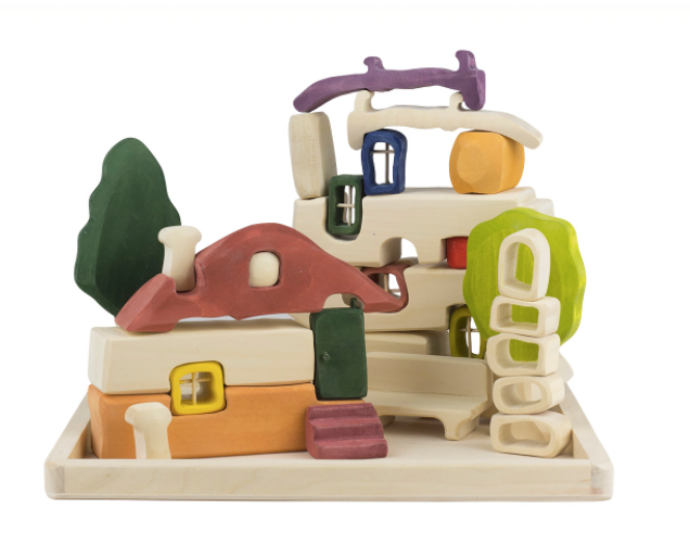 Colorful wooden toy set with houses and trees on a white background