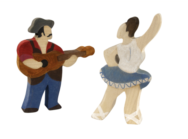 Wooden figurines of a man playing guitar and a woman dancing on a white background