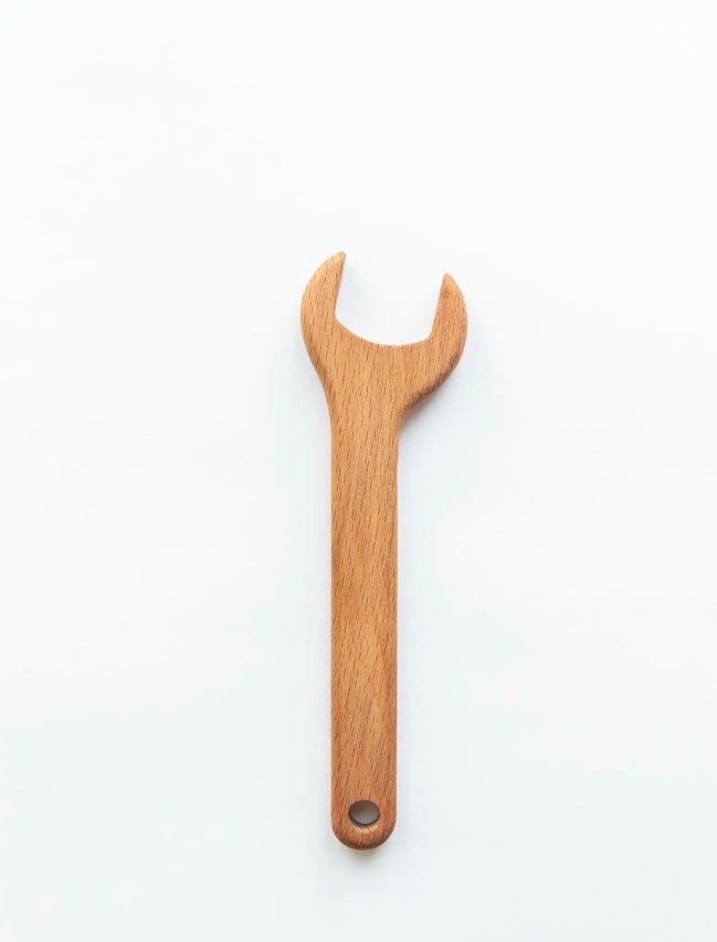 Wooden wrench on a white background