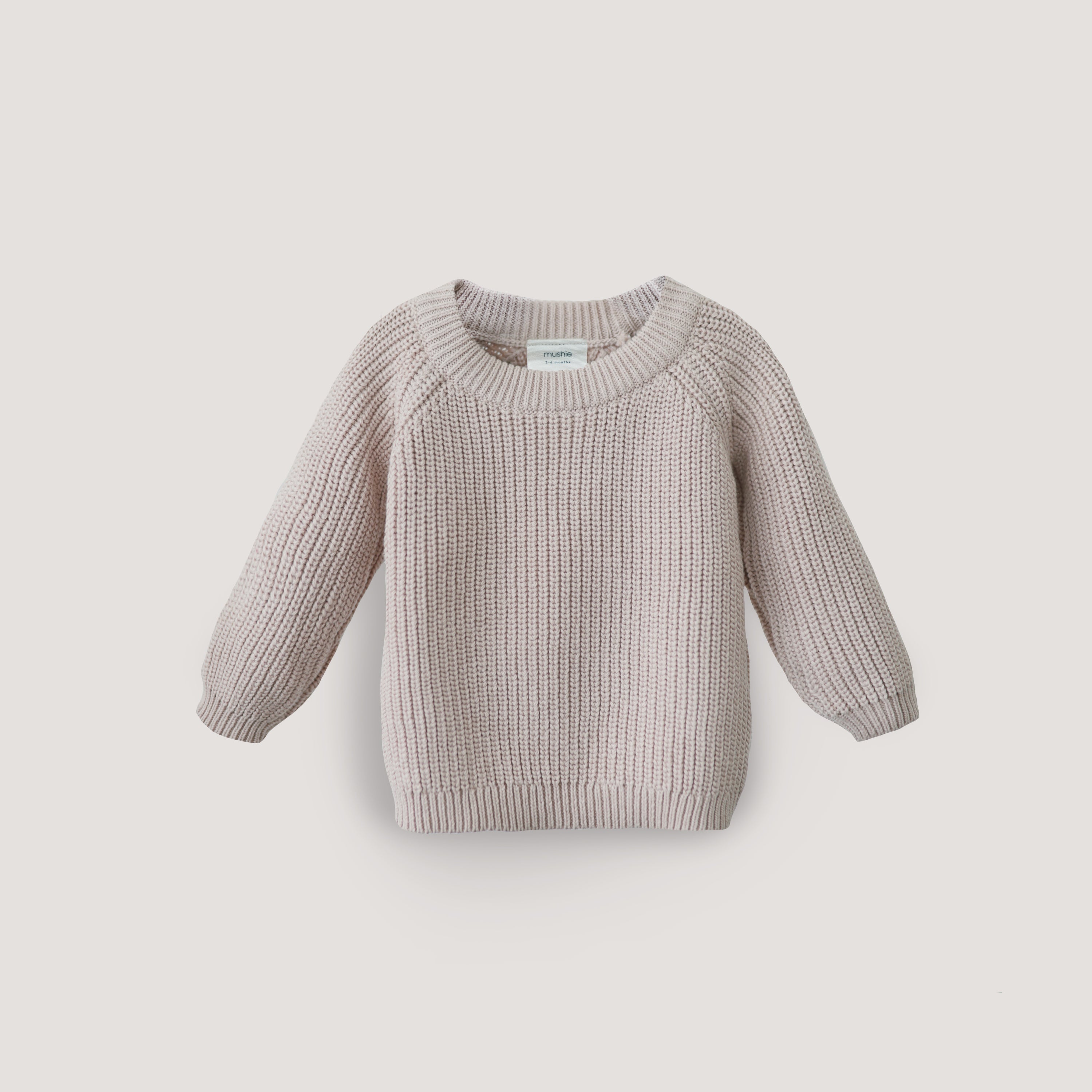 Knitted sweater on a light gray background