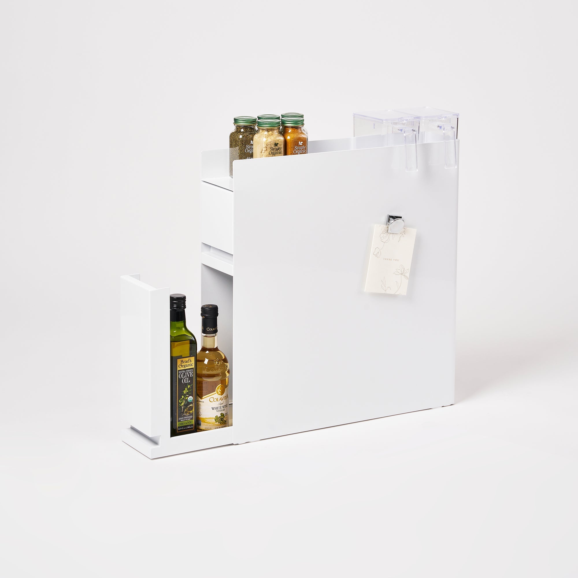 White gift box with olive oil bottles and jars on a white background